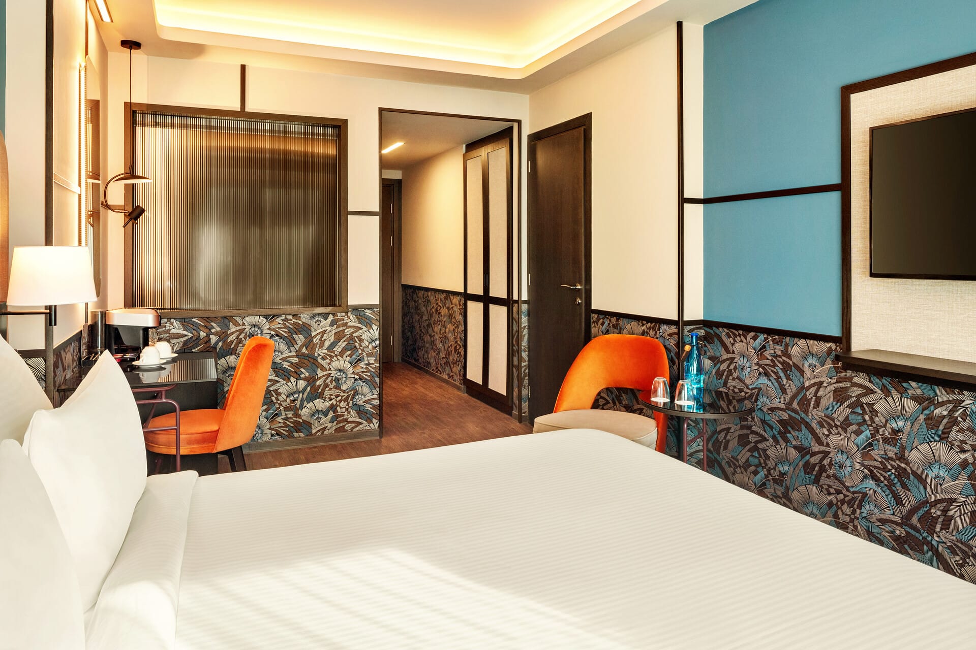 a room with a bed and a tv