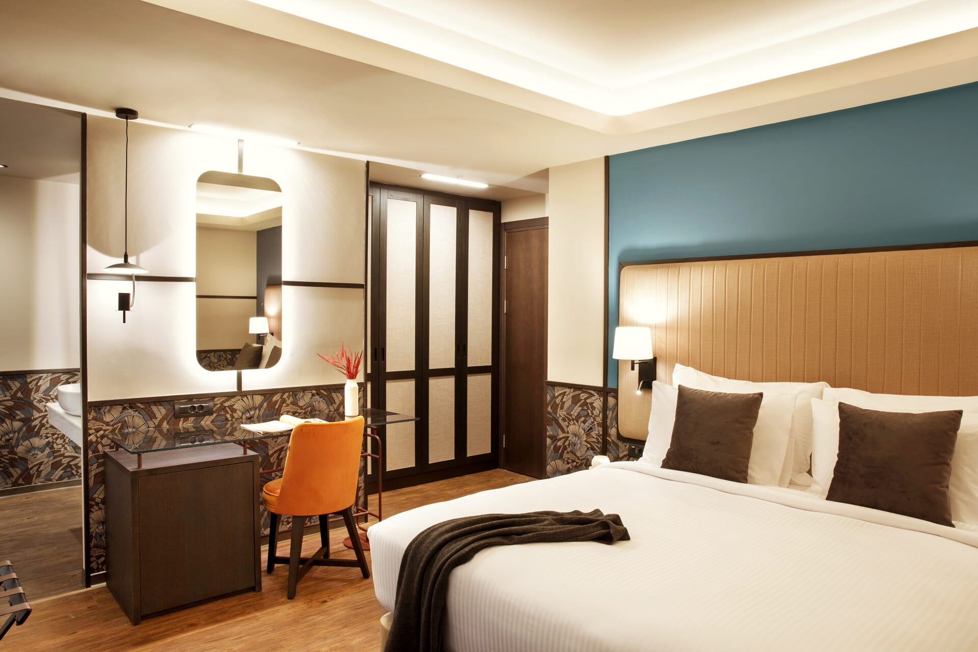 a hotel room with a large mirror