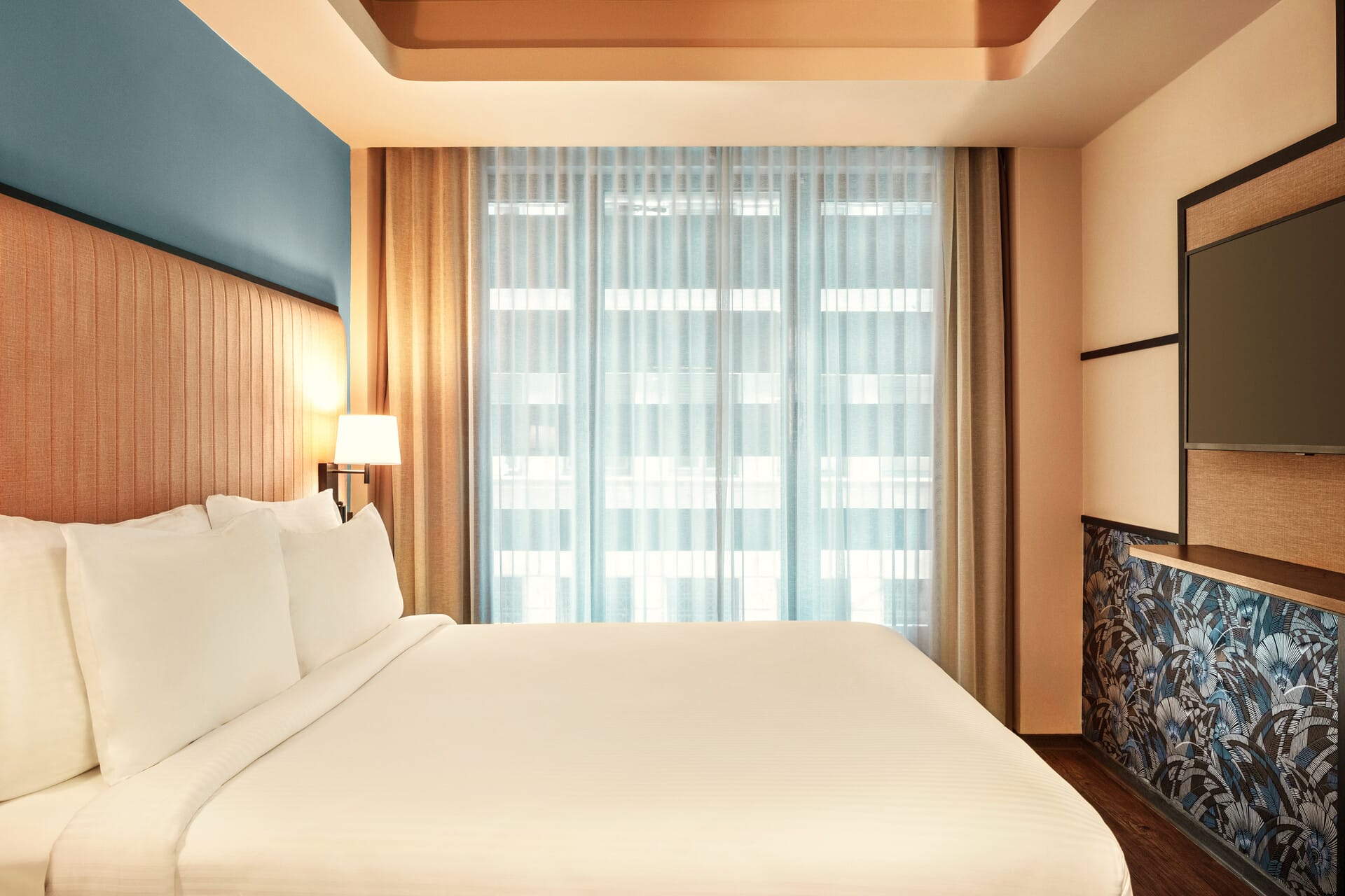 a bed with a white comforter