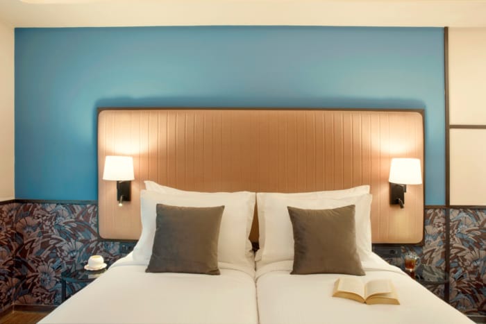 a hotel room with two beds