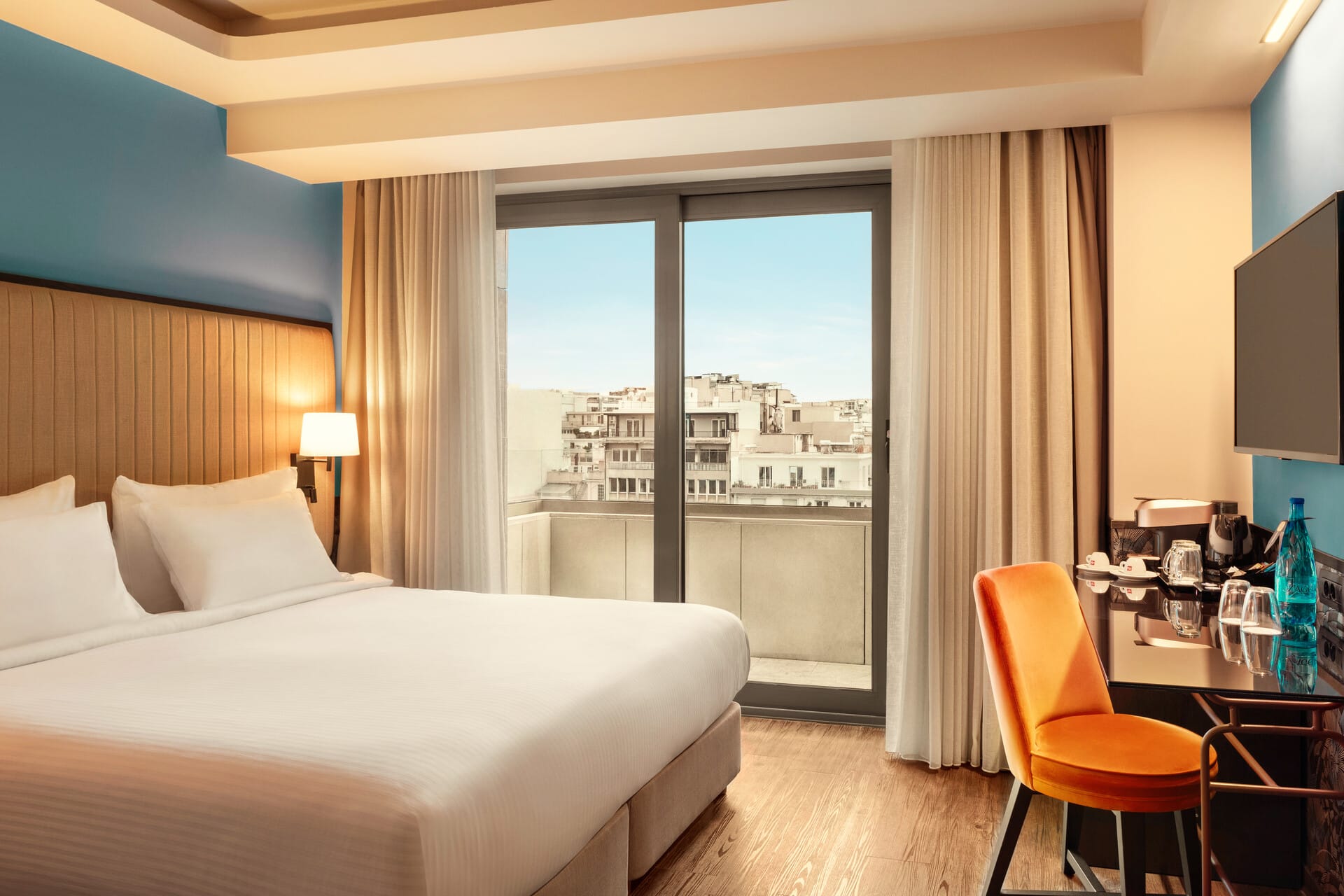 a bedroom with a large window