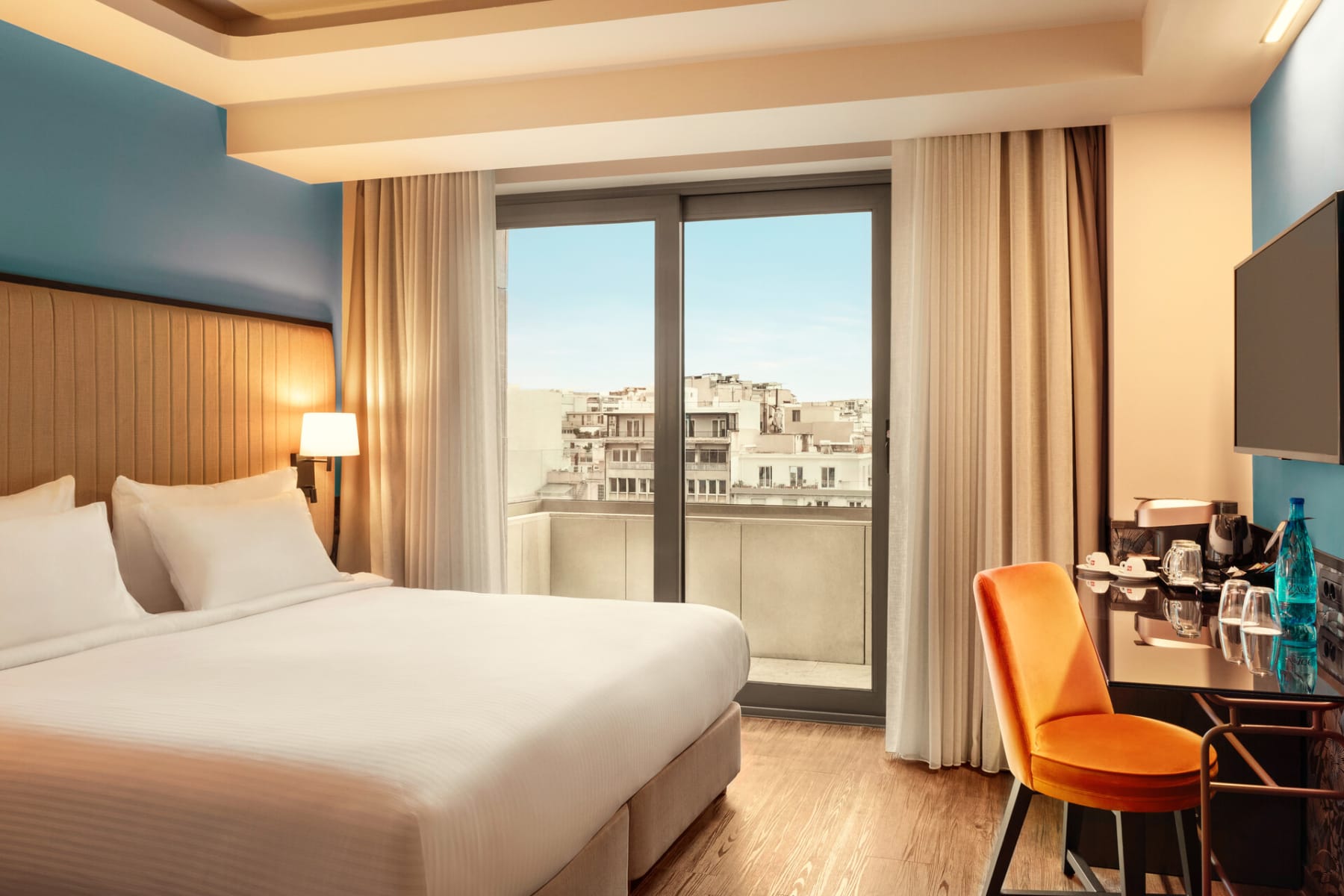 a bedroom with a large window