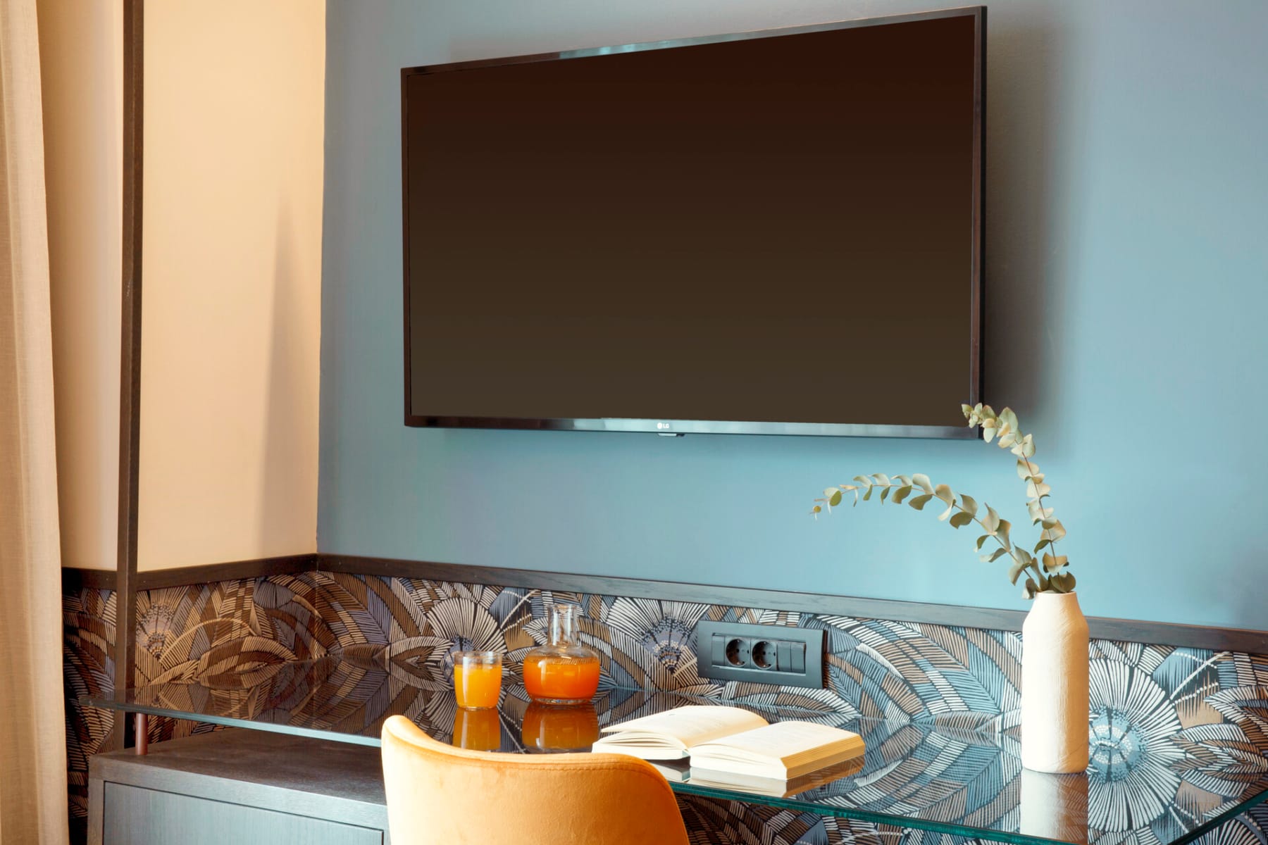 a table with a tv and objects on it
