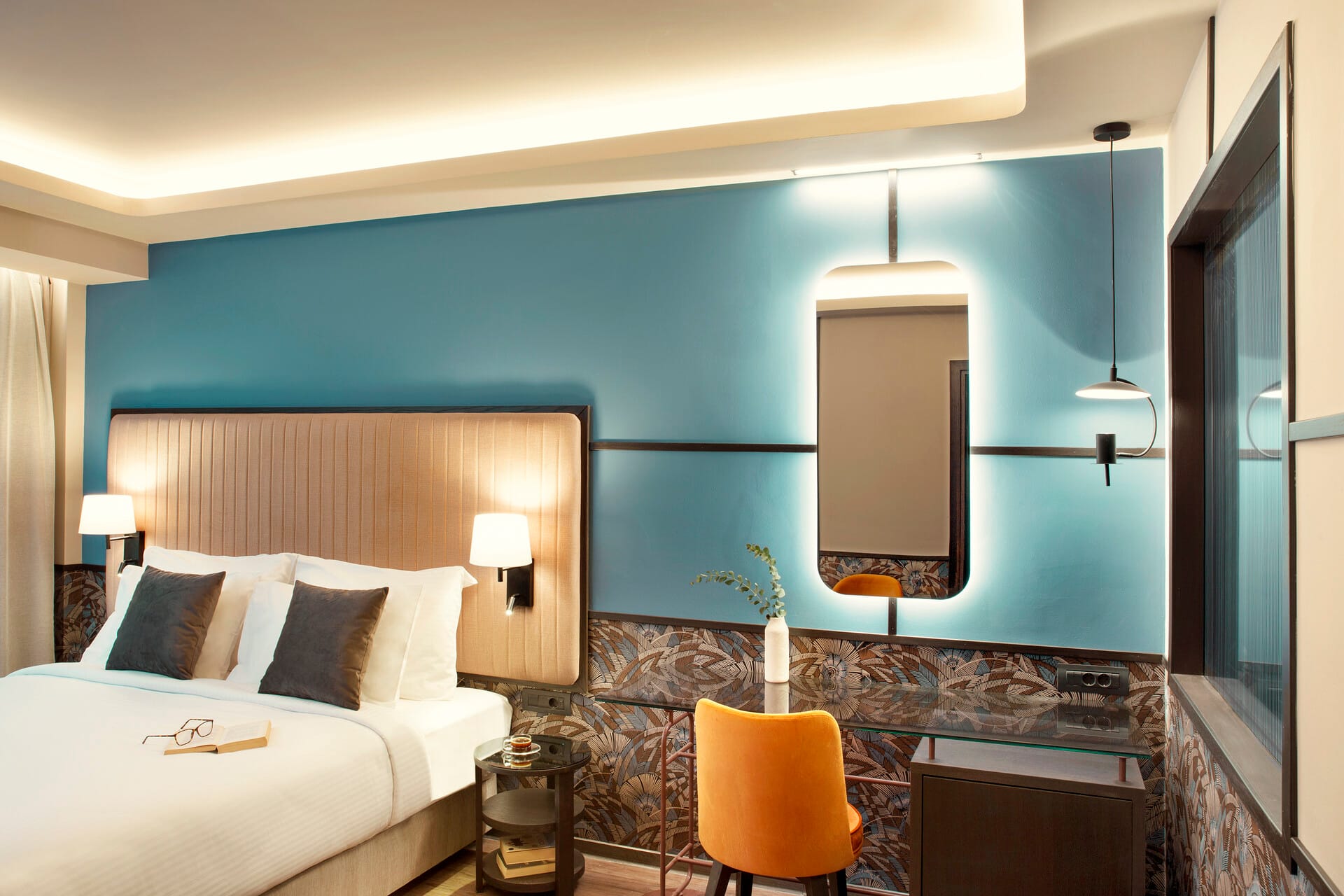 a bedroom with a large mirror