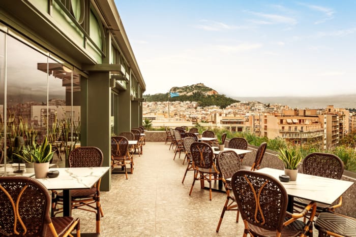a patio with tables and chairs