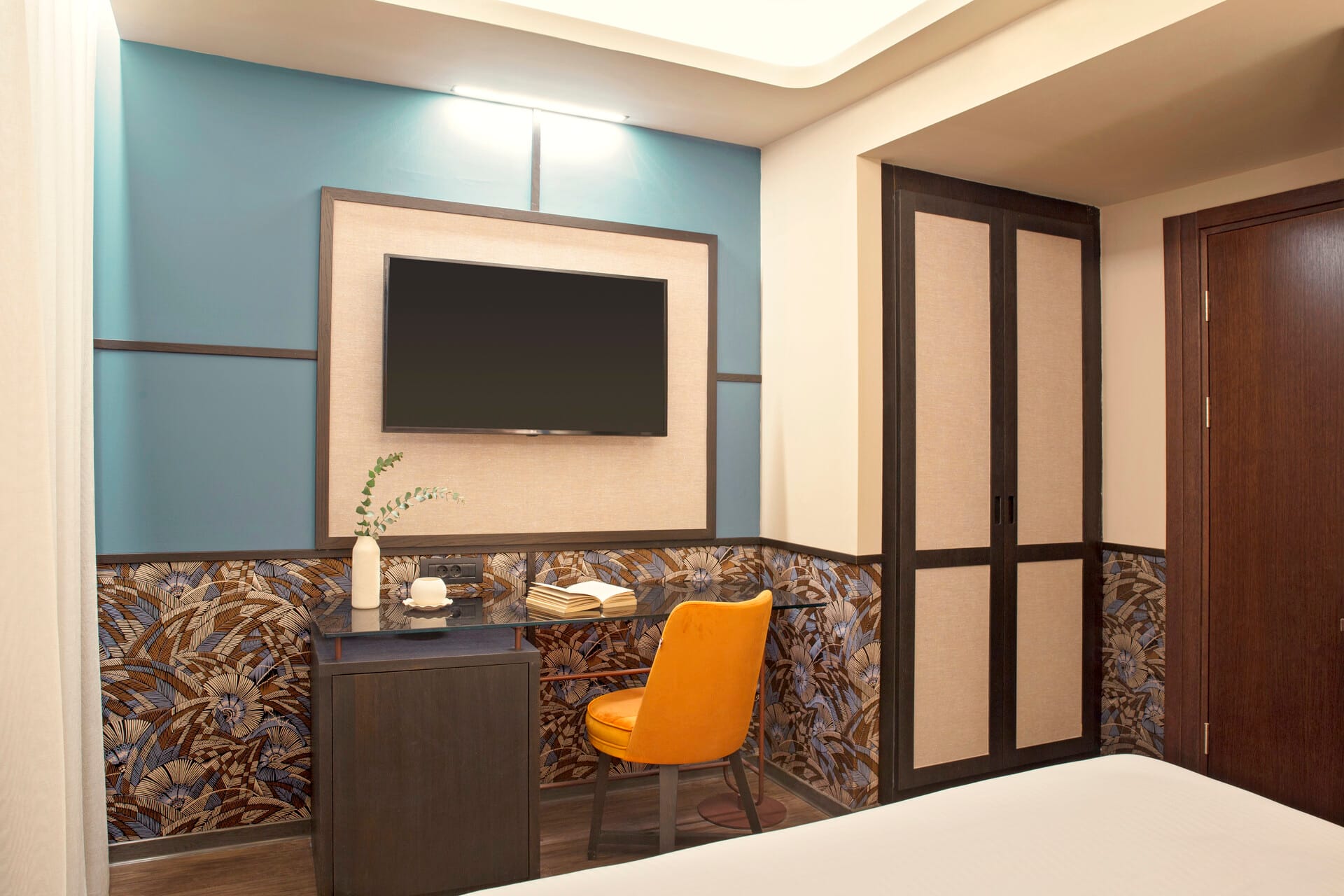 a room with a tv and a chair