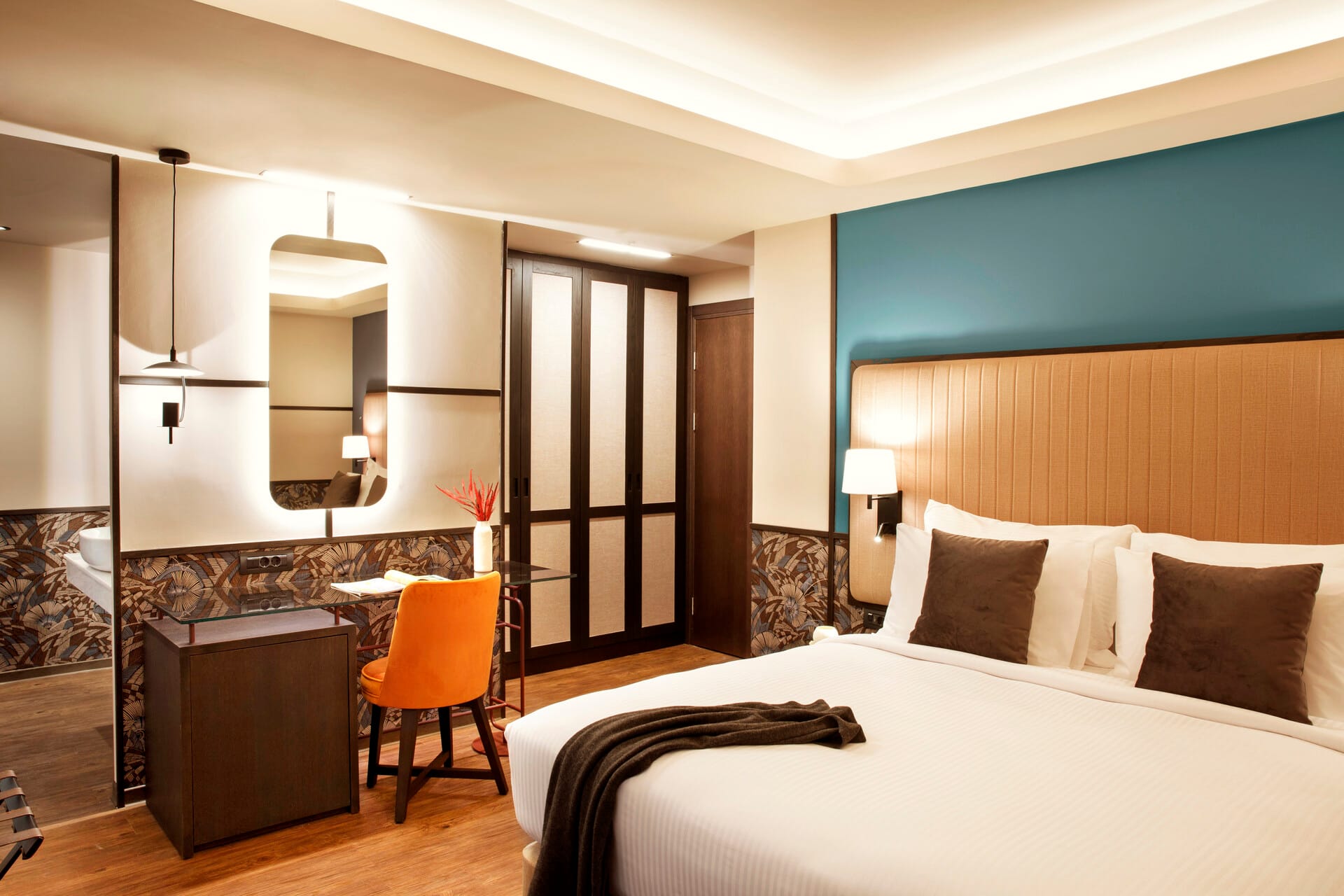 a hotel room with a large mirror