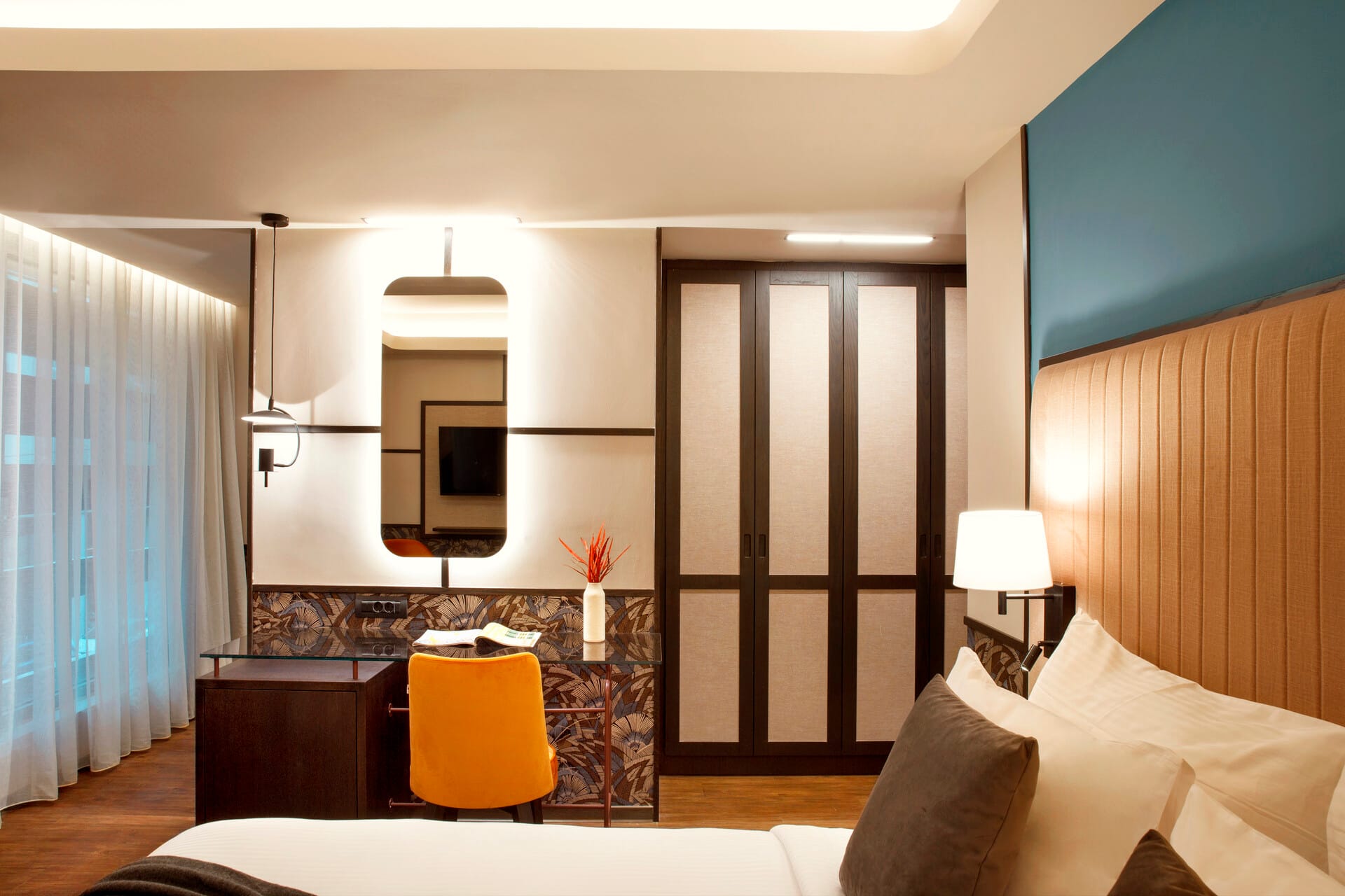 a bedroom with a large mirror