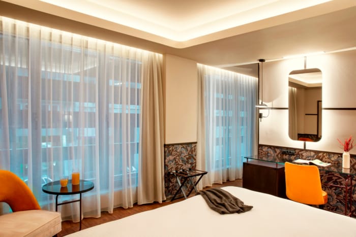a bedroom with a large window