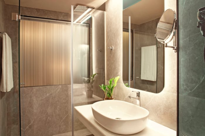 a bathroom with a sink and a mirror