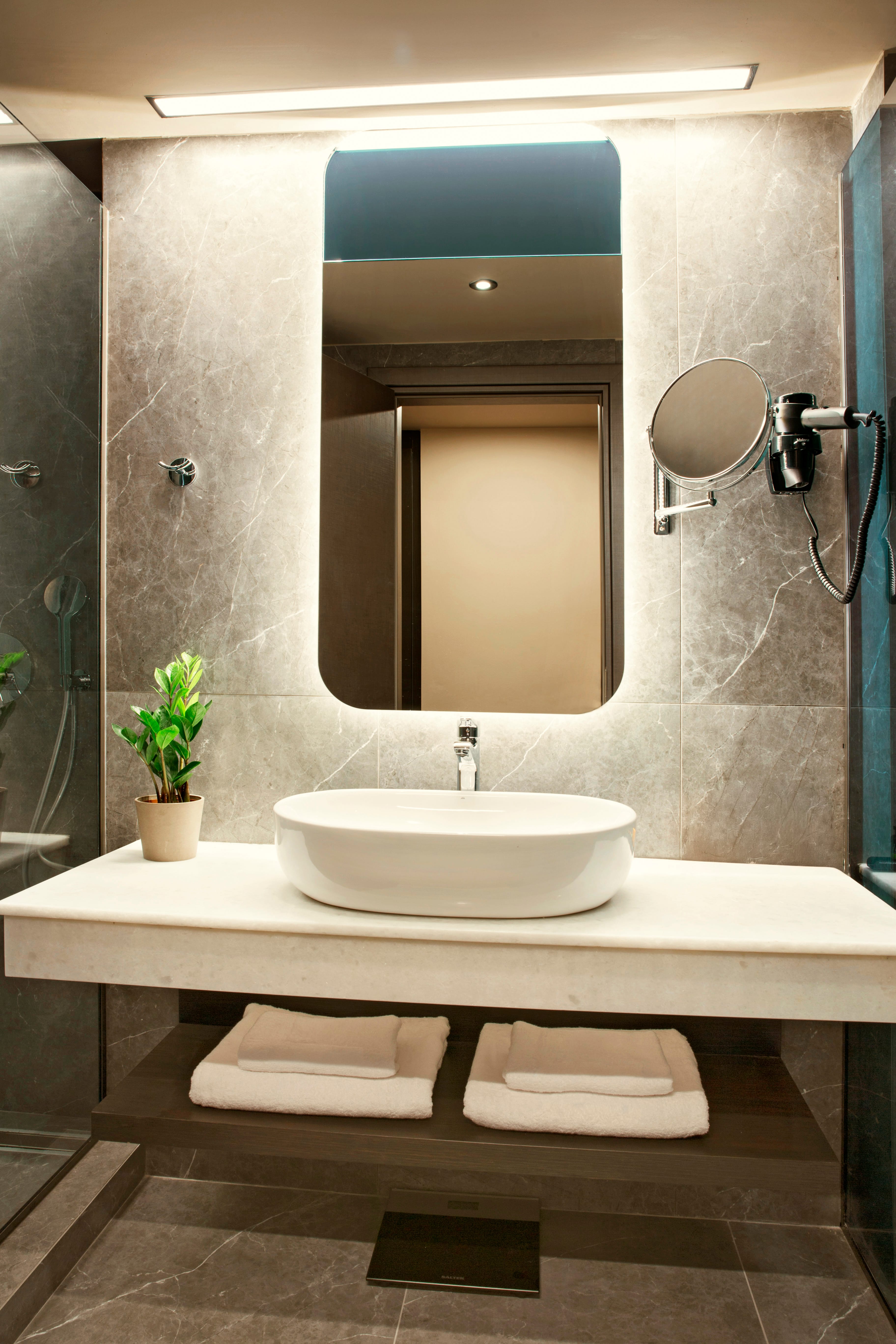 a bathroom with a large mirror