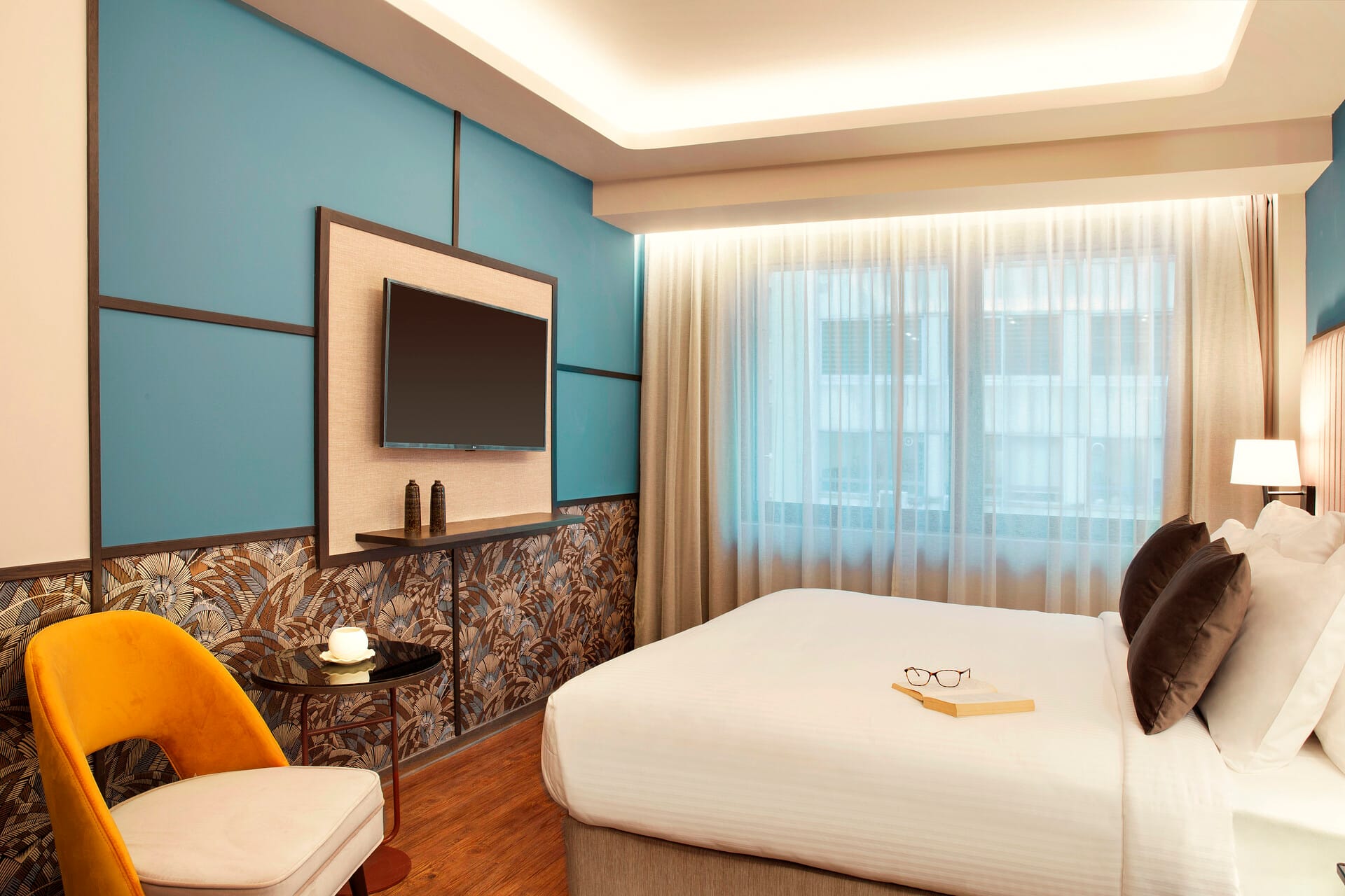 a bedroom with a large window