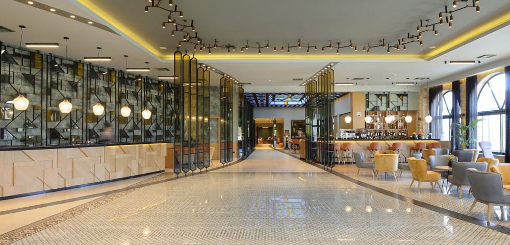 a large empty room with tables and chairs