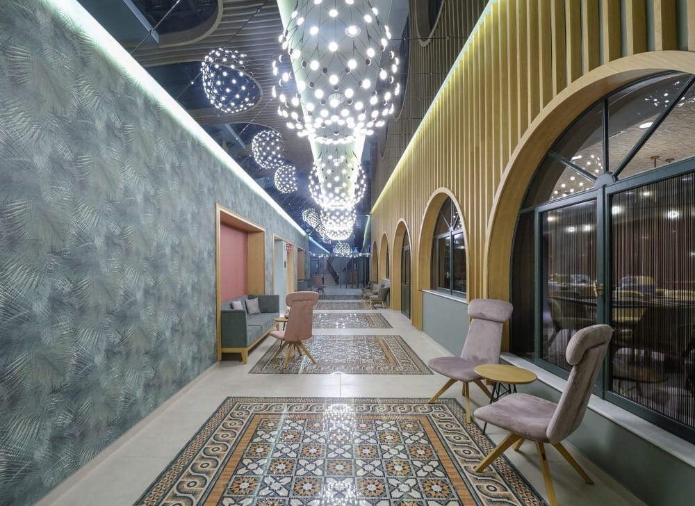 a room with a large chandelier and a table