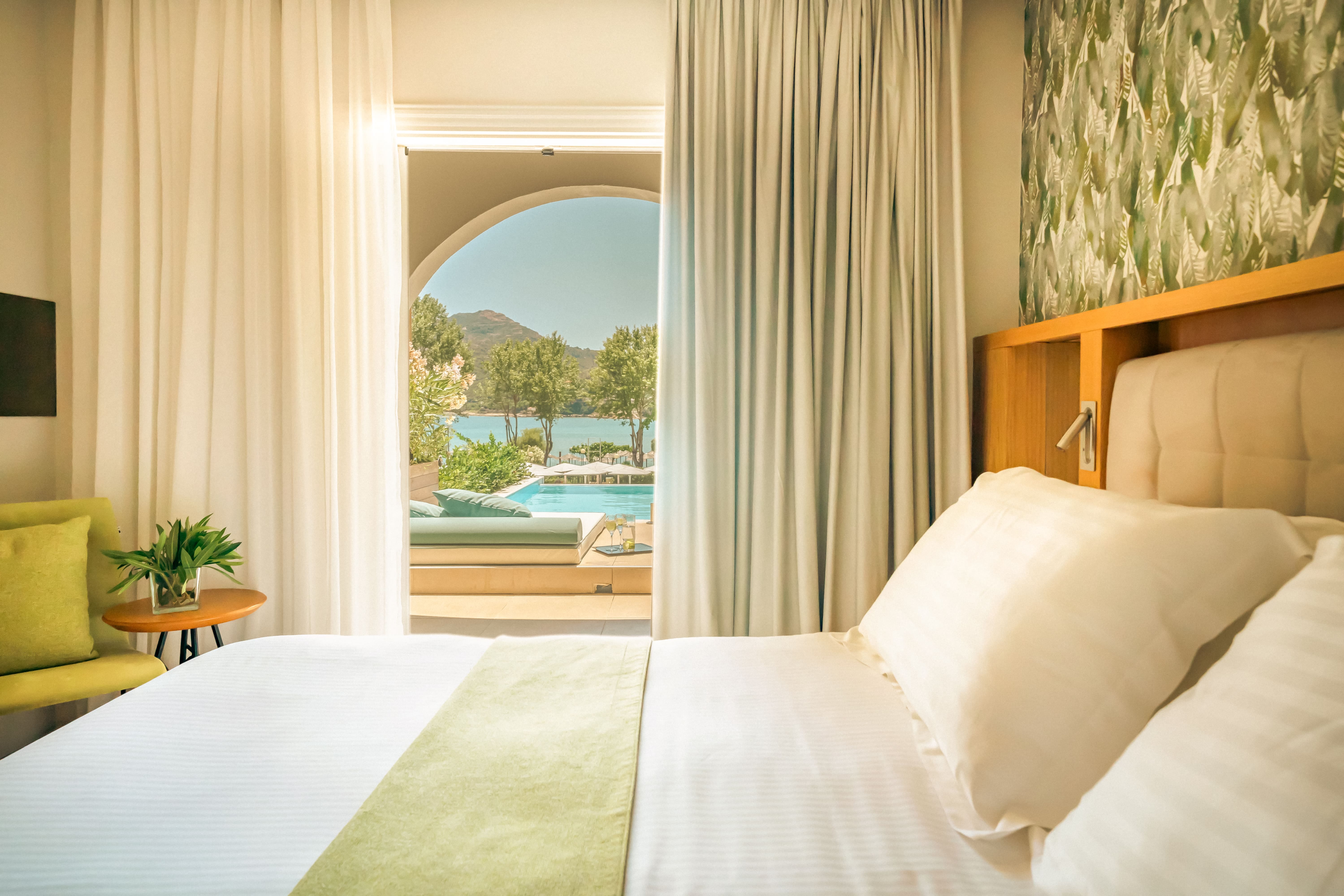 a bed with a view of a pool