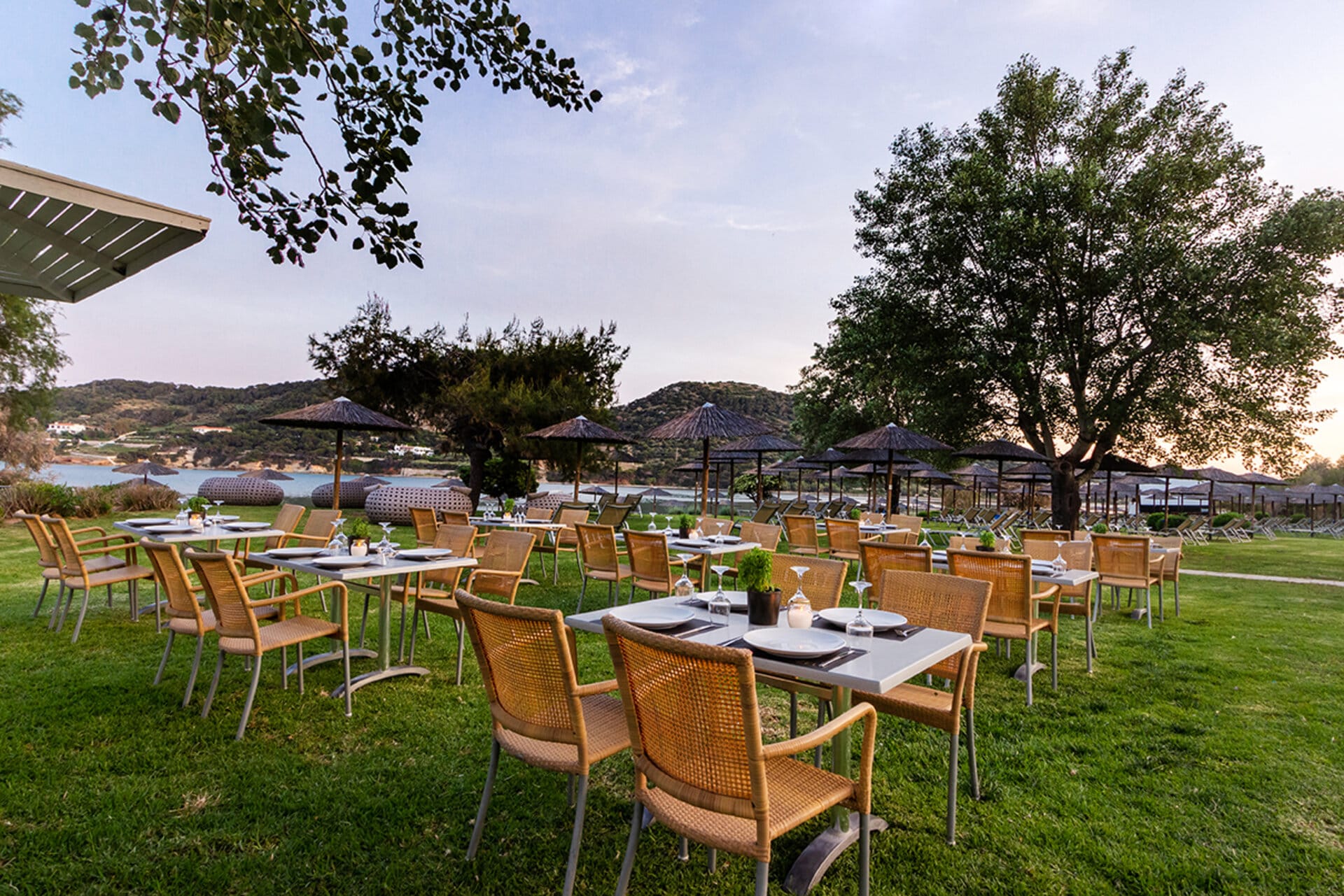 a group of tables and chairs outside