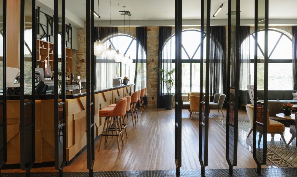 a room with glass walls and tables