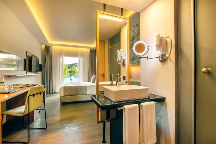 a bathroom with a mirror and sink