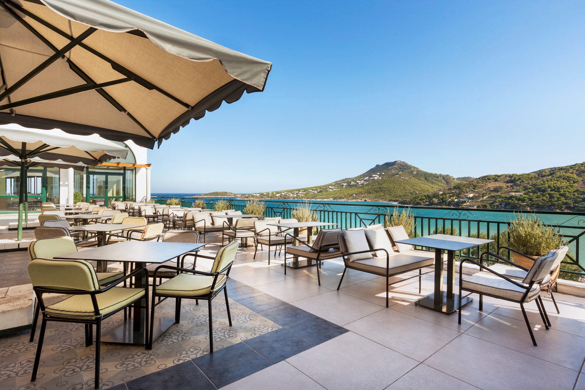 a patio with tables and chairs