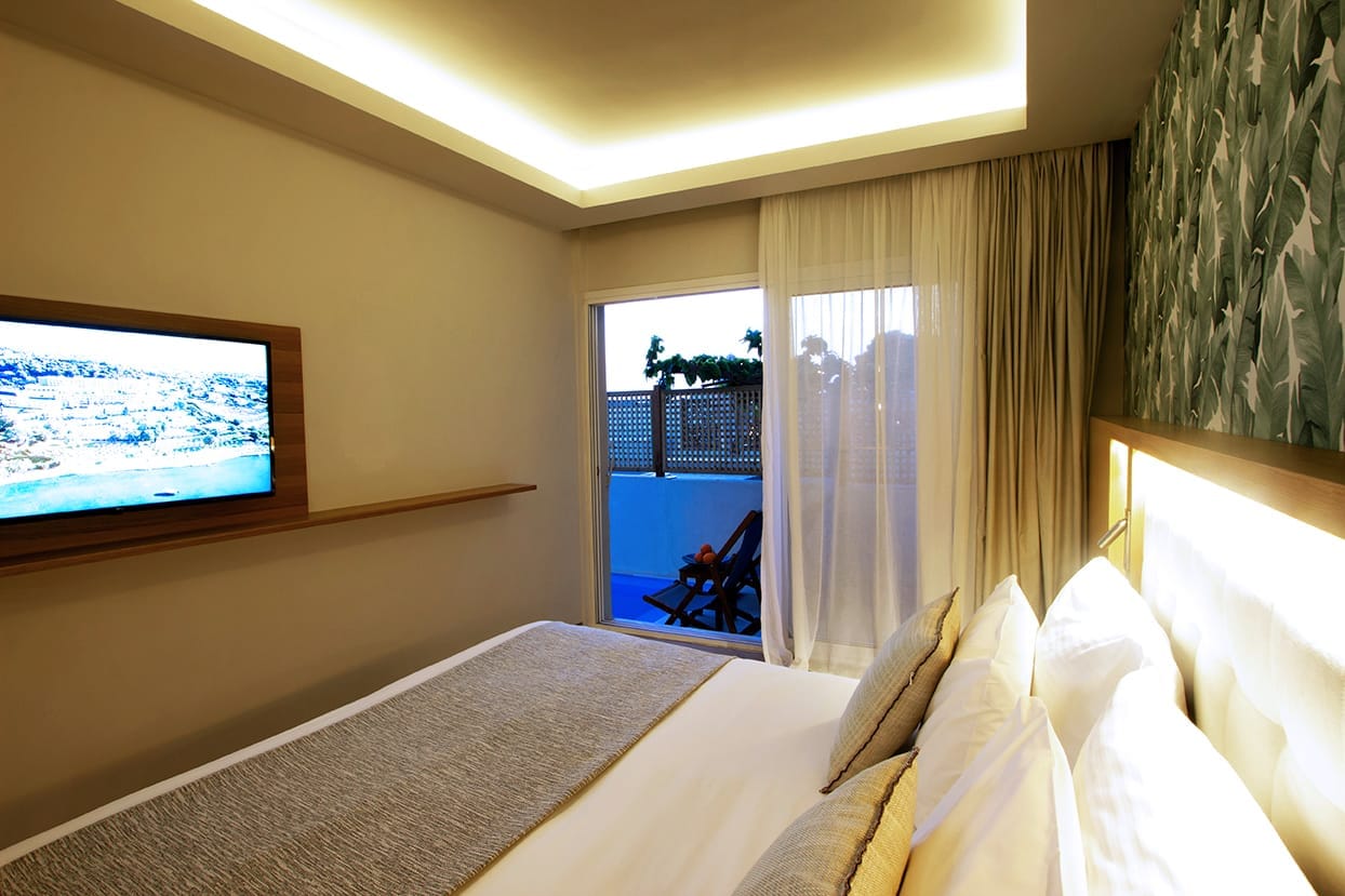 a bedroom with a large television