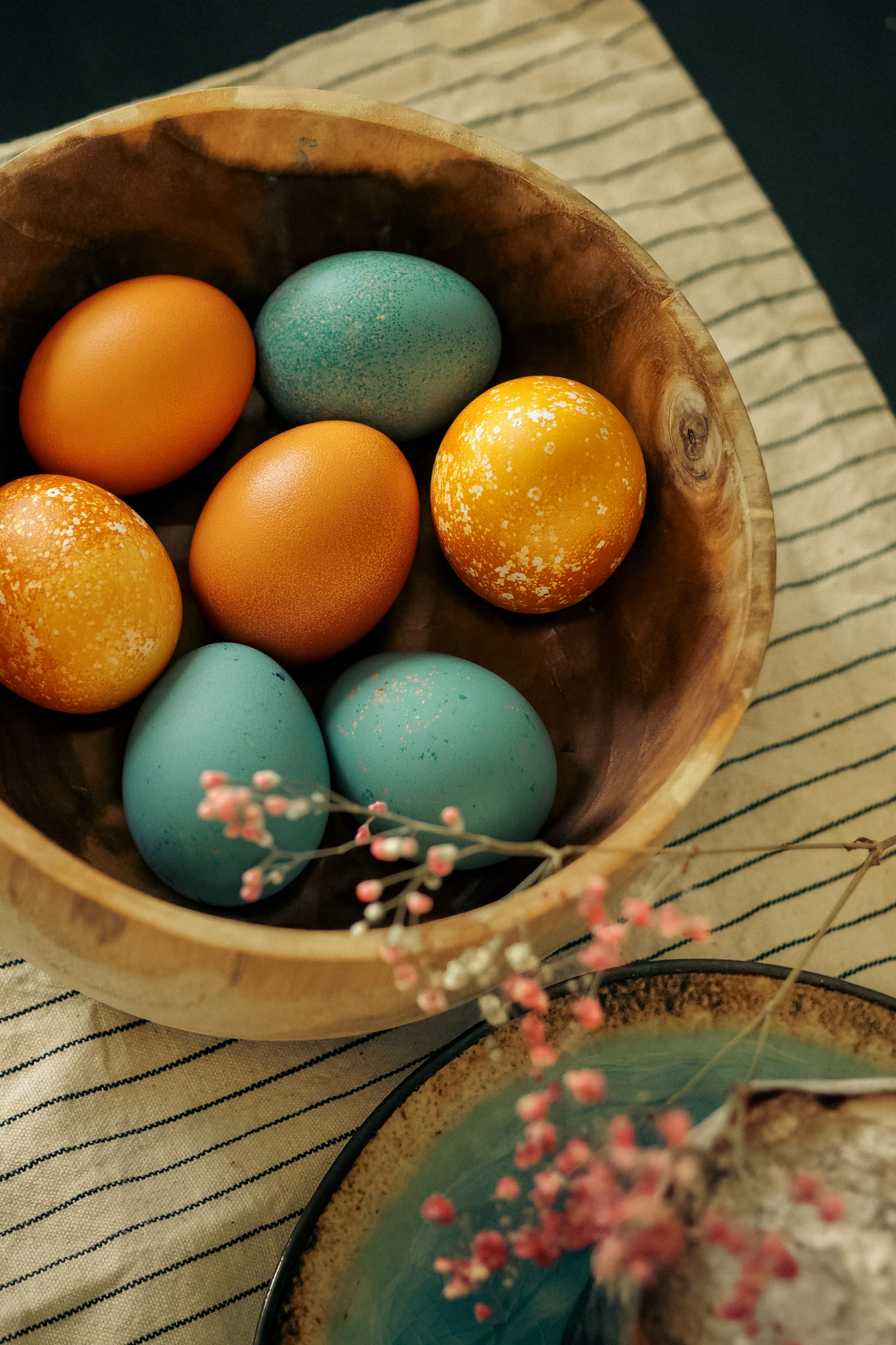 a bowl of colorful eggs