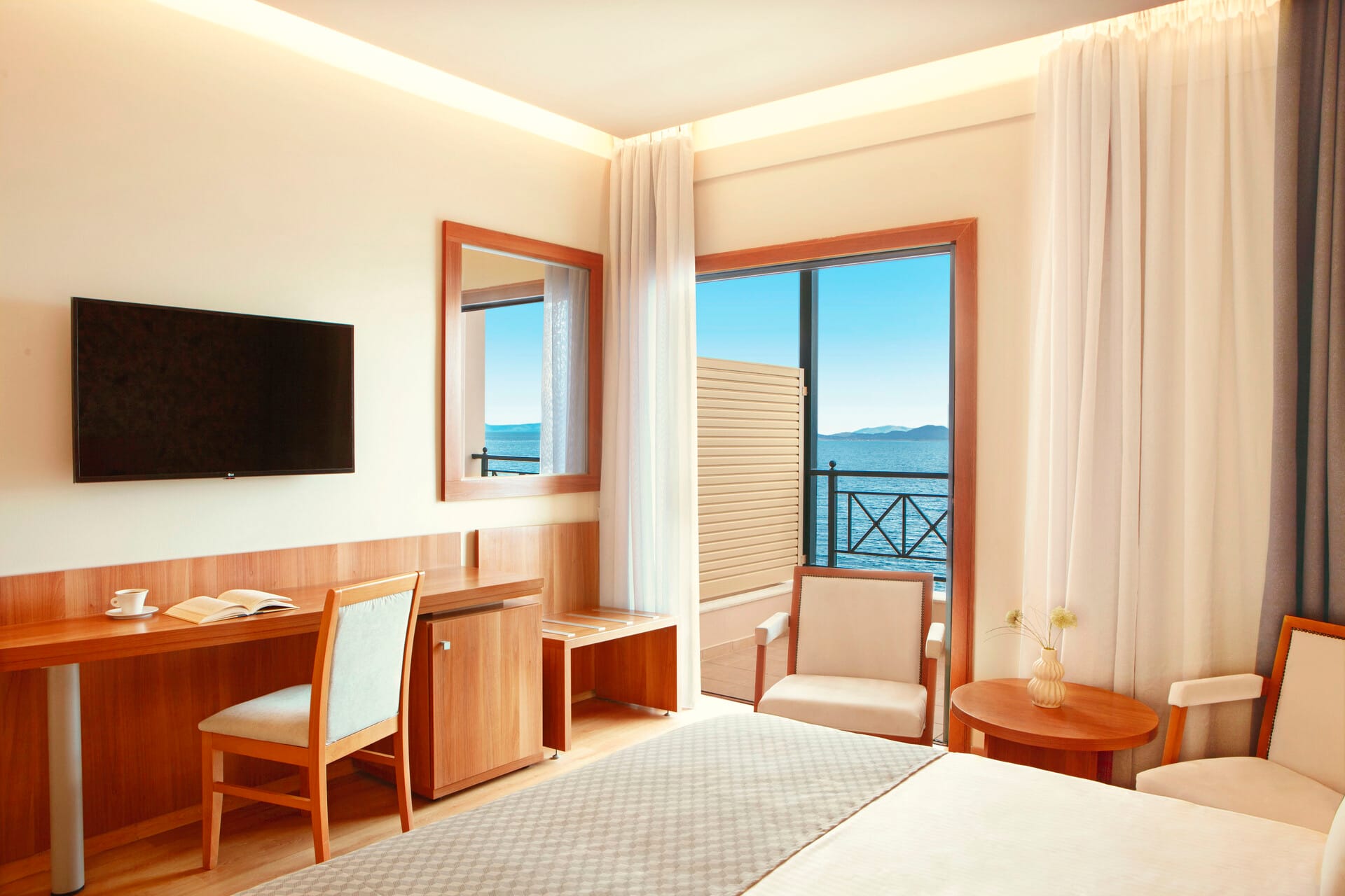 a room with a tv and chairs