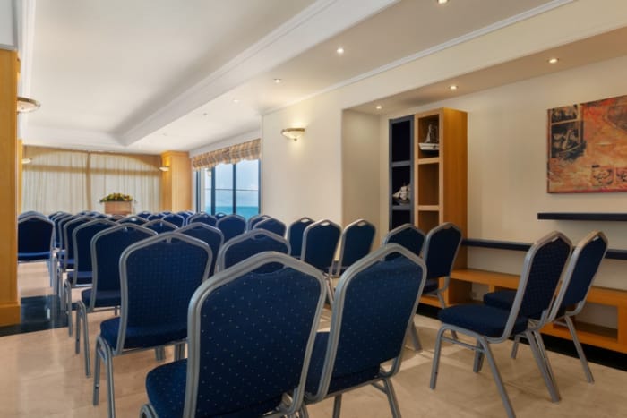a room with blue chairs
