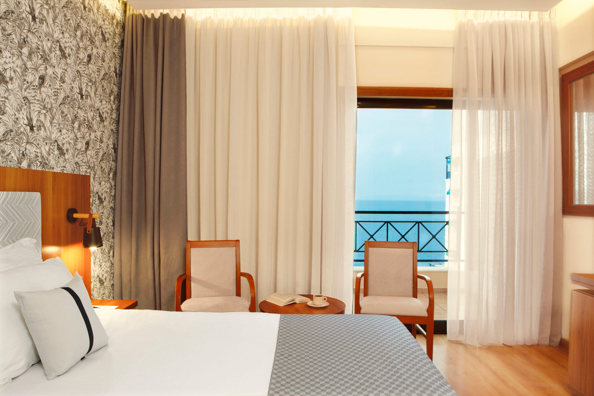 a bedroom with a view of the ocean