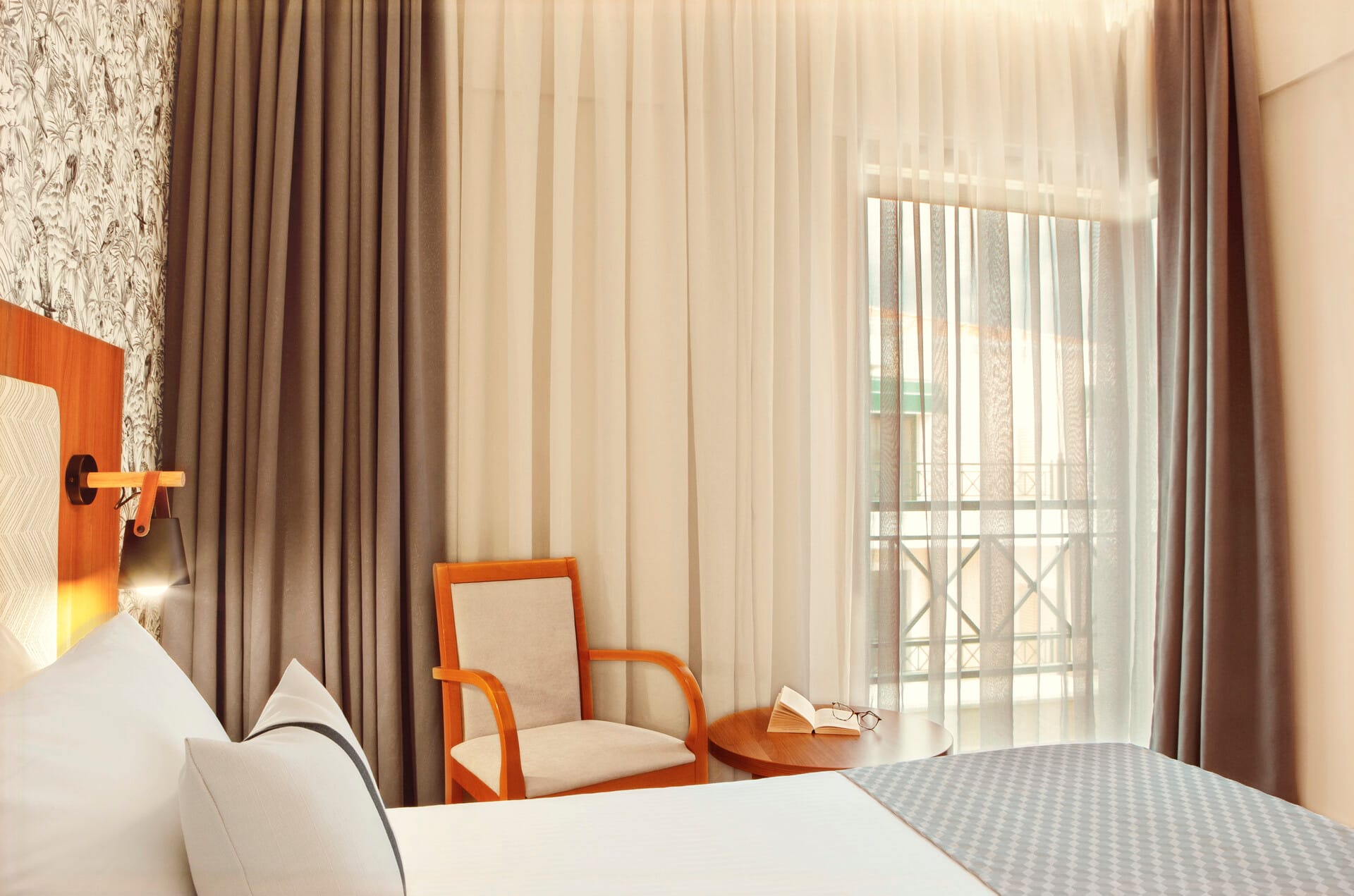 a chair and a table in a room with a window