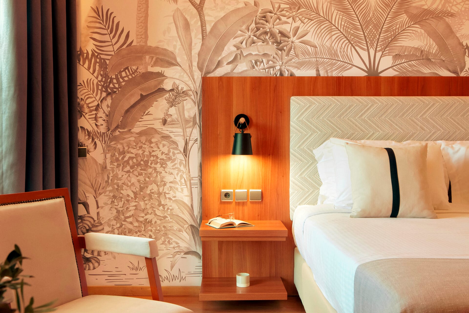 a room with a bed and a lamp