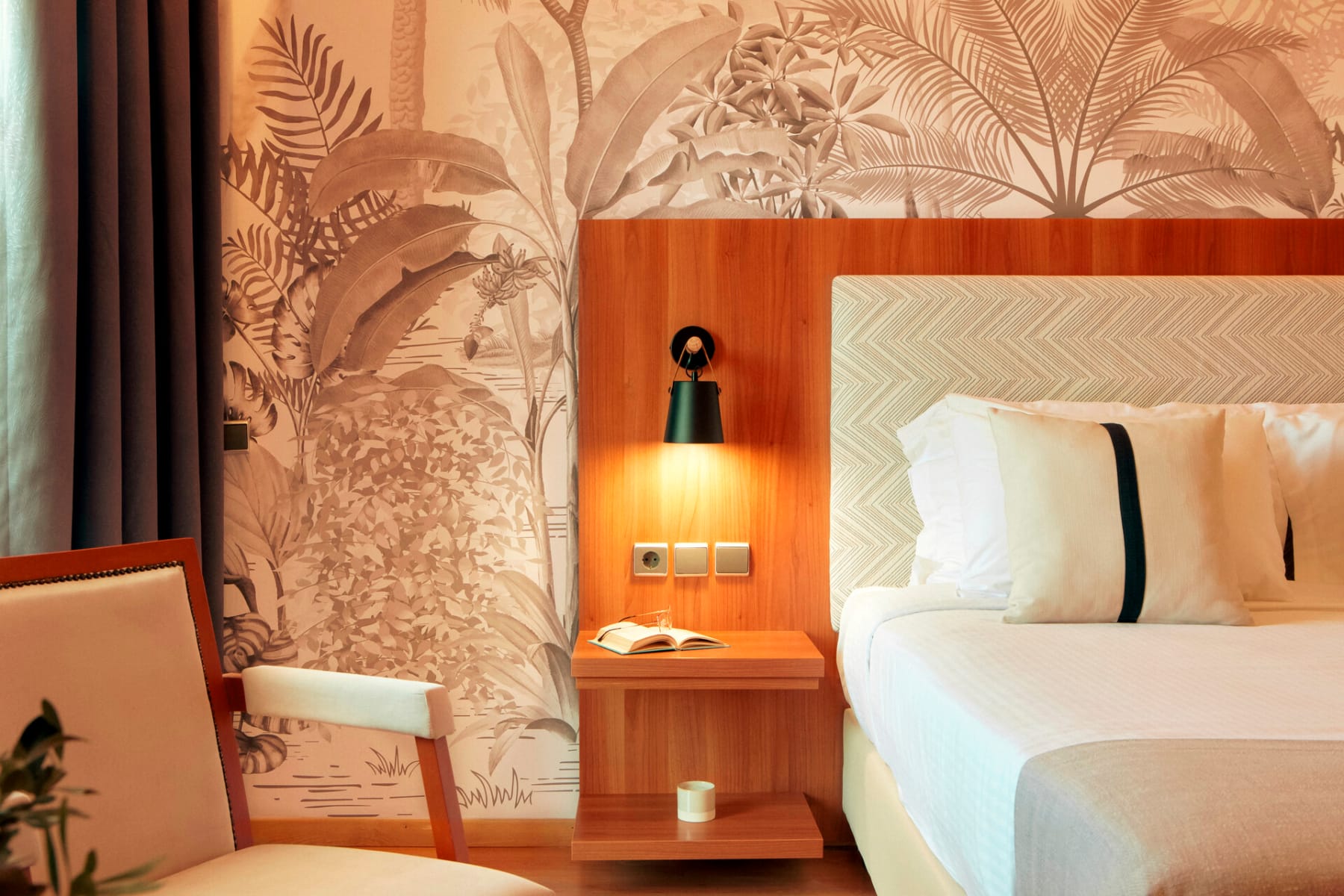 a room with a bed and a lamp