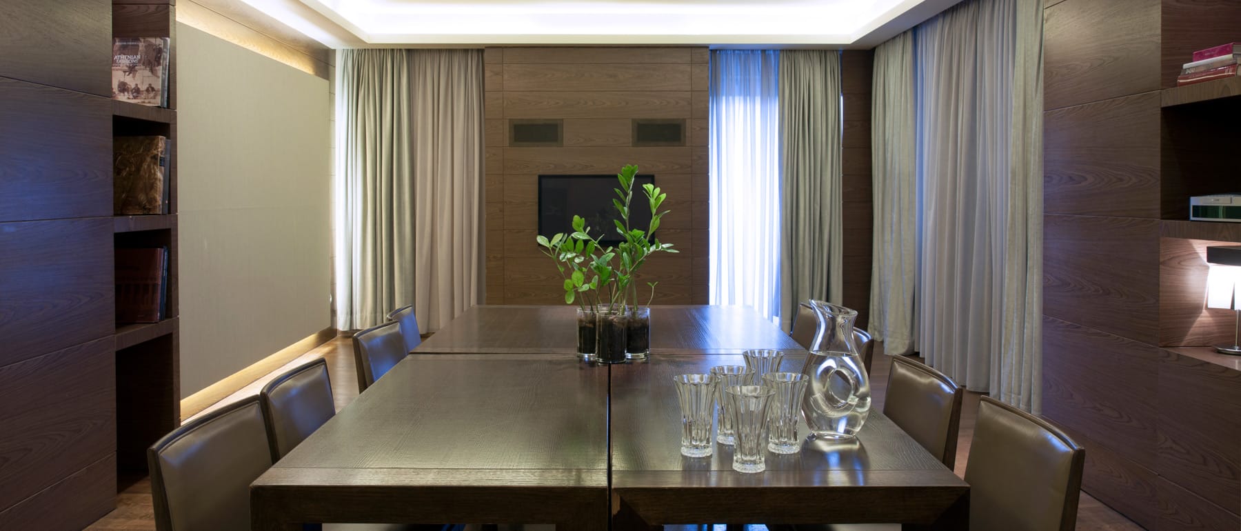 a table with glasses and a plant on it