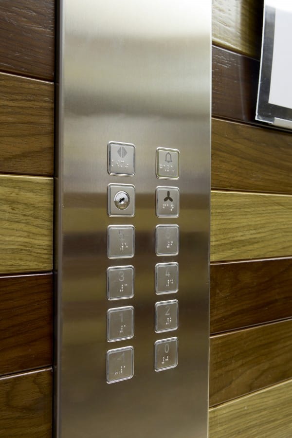 a silver refrigerator with buttons