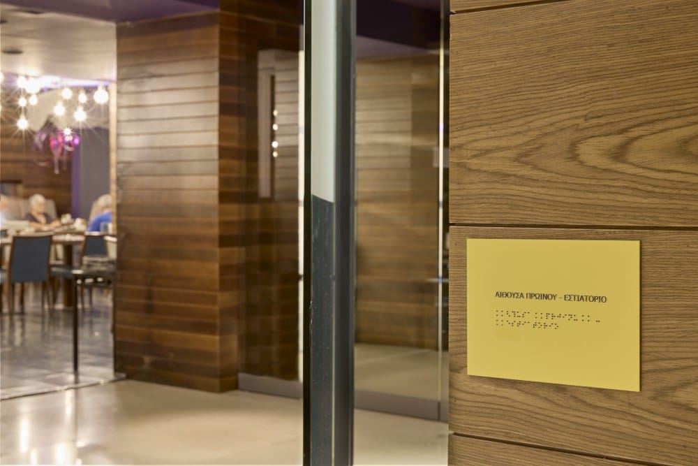 a glass door with a sign on it