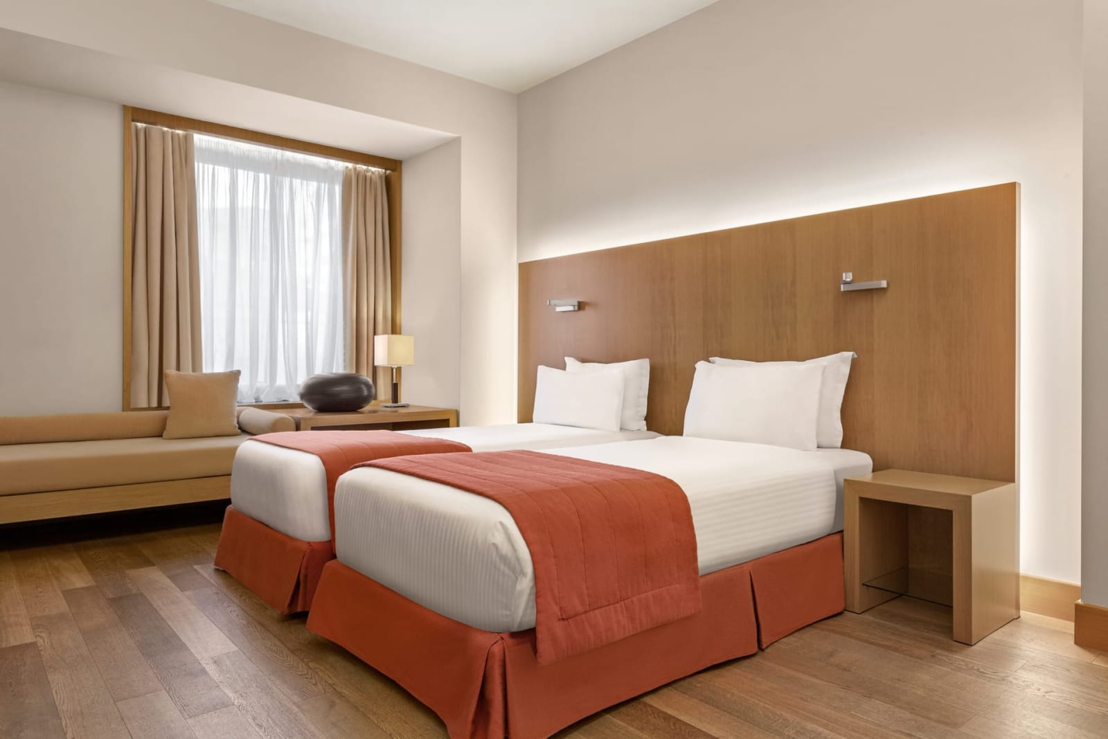 a hotel room with a bed and a couch