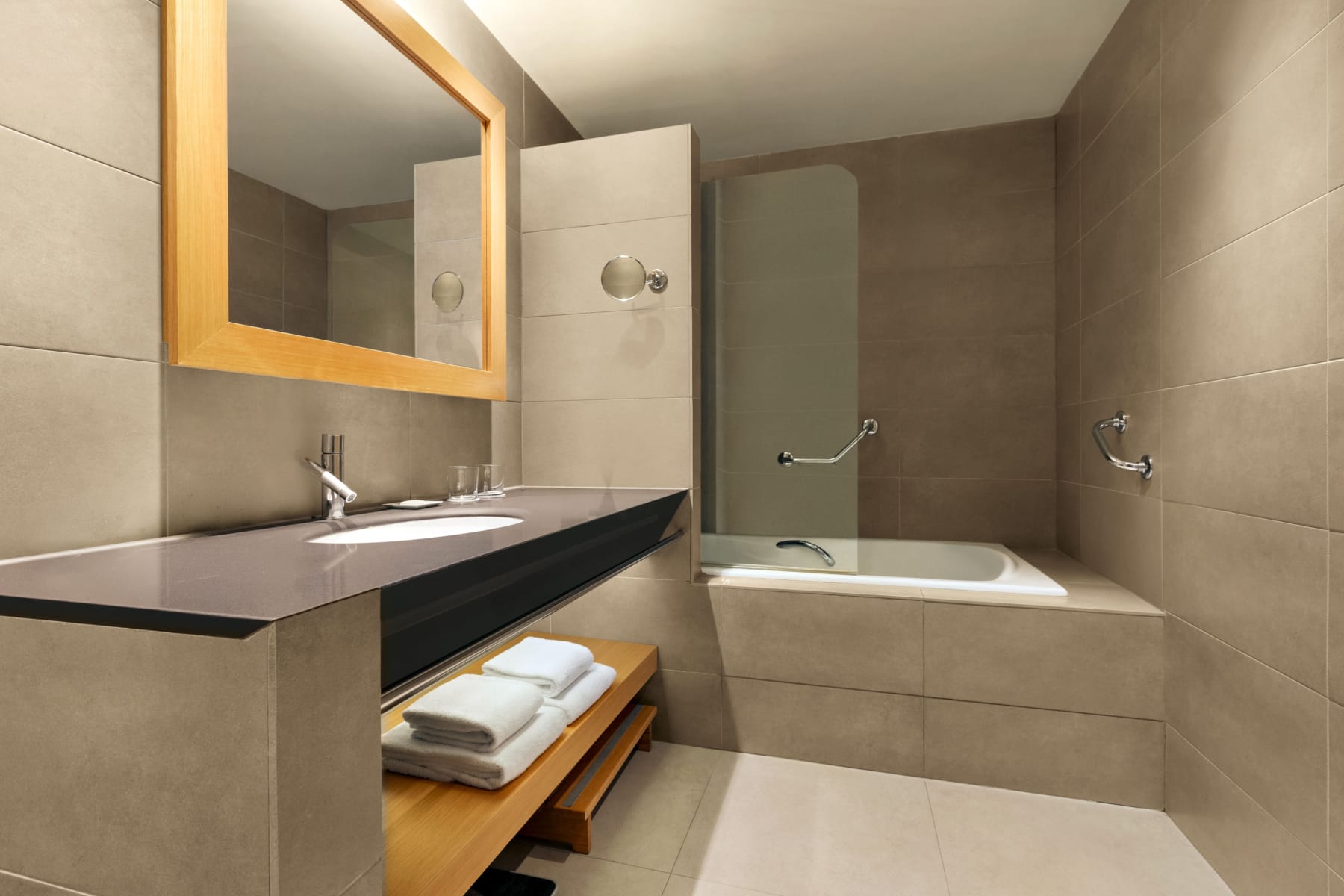 a bathroom with a bathtub and a mirror