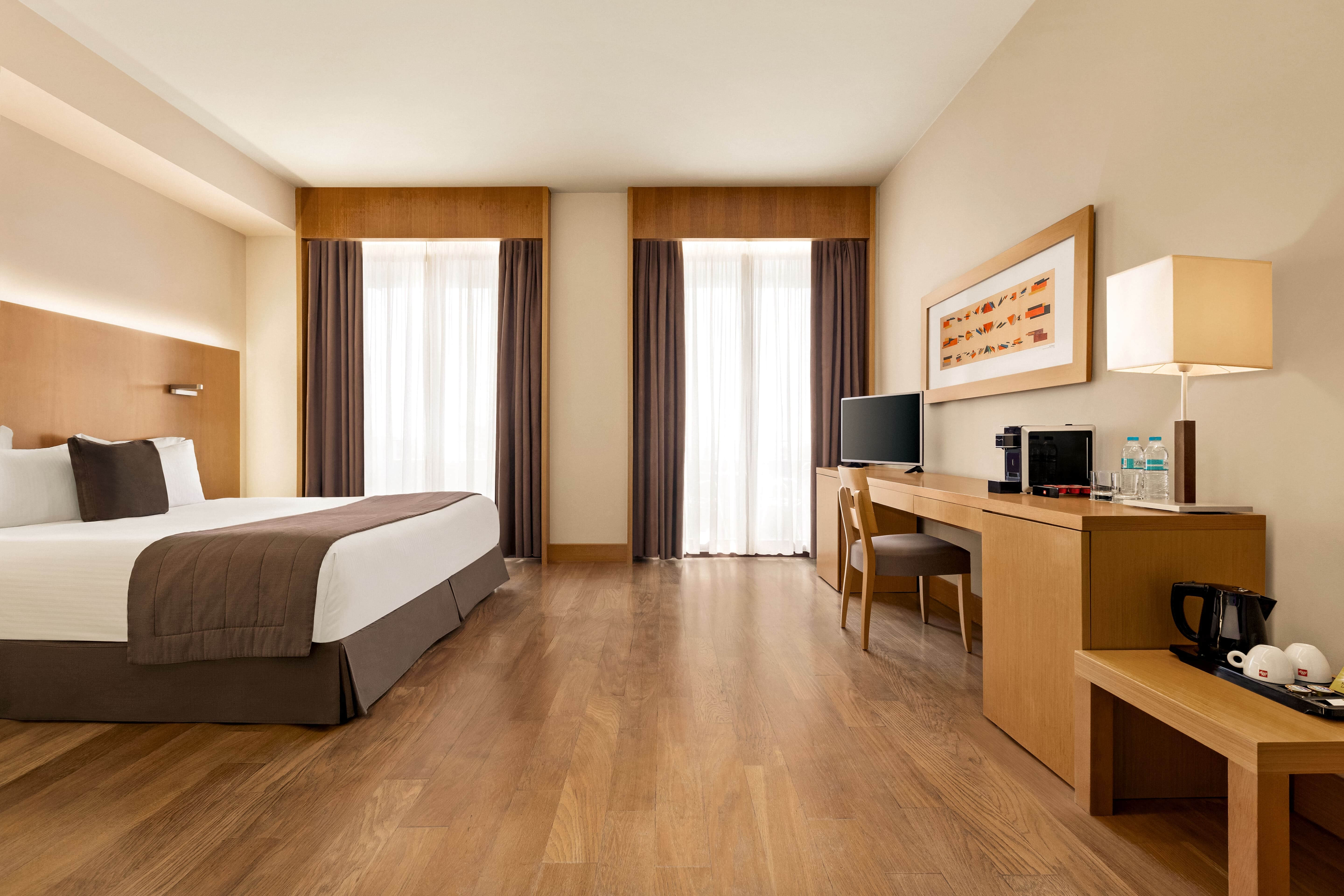 a room with a bed and desk