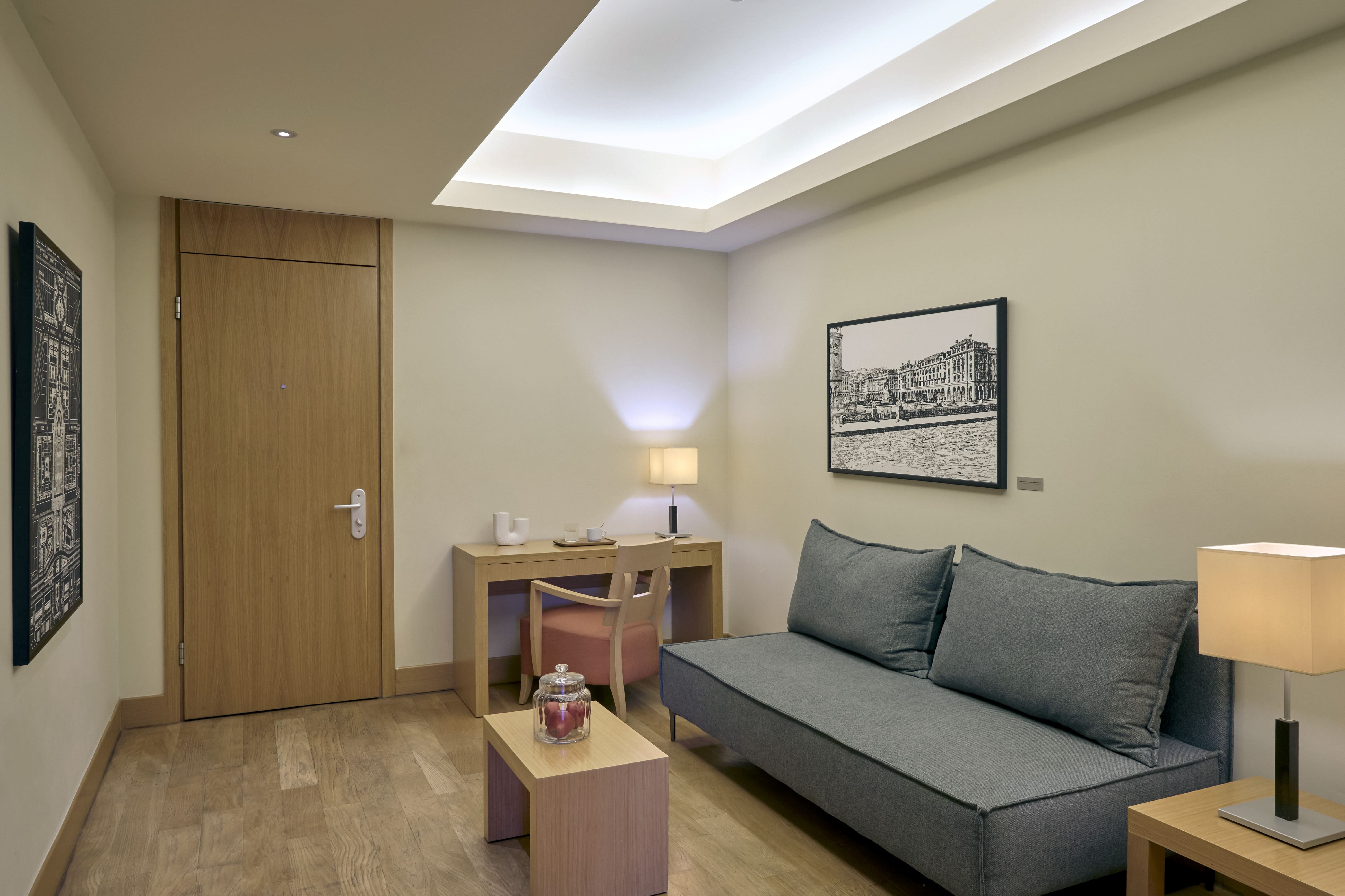a room with a couch and desk