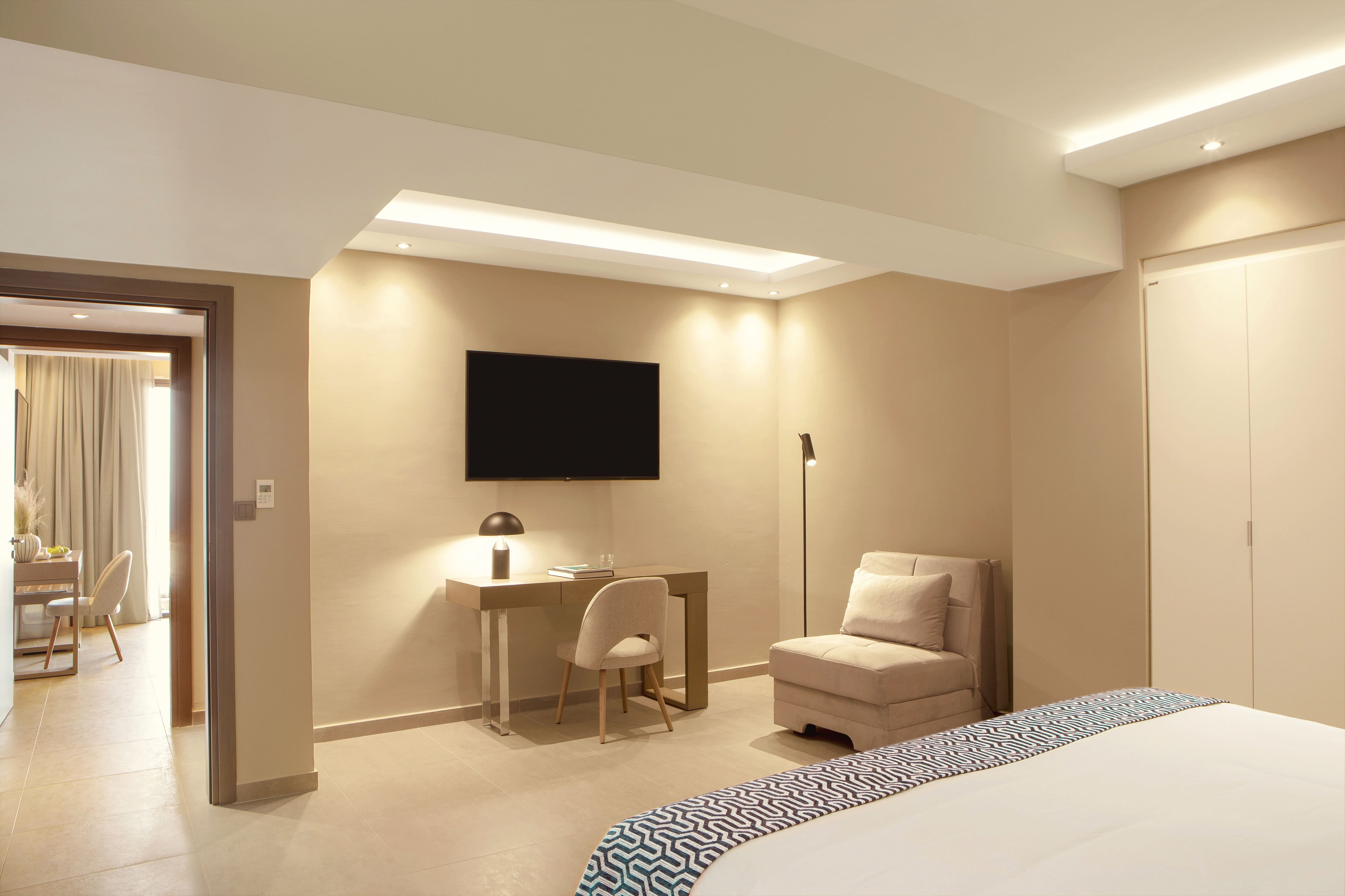 a bedroom with a bed and a chair
