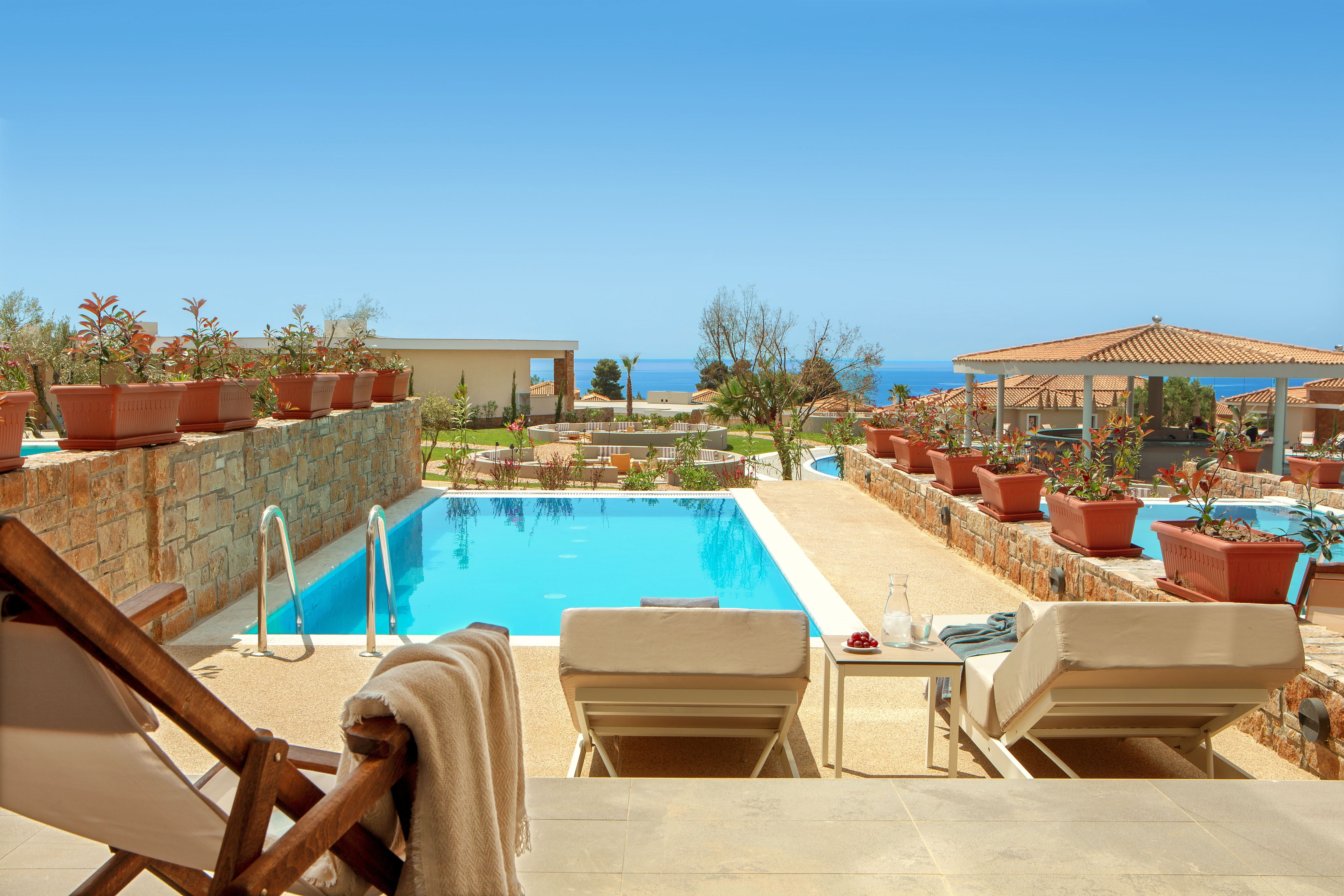 a pool with chairs and a deck chair