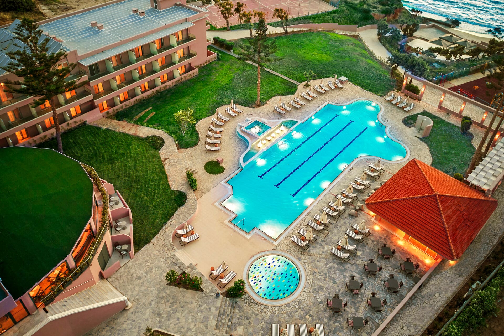 a swimming pool with a building in the background