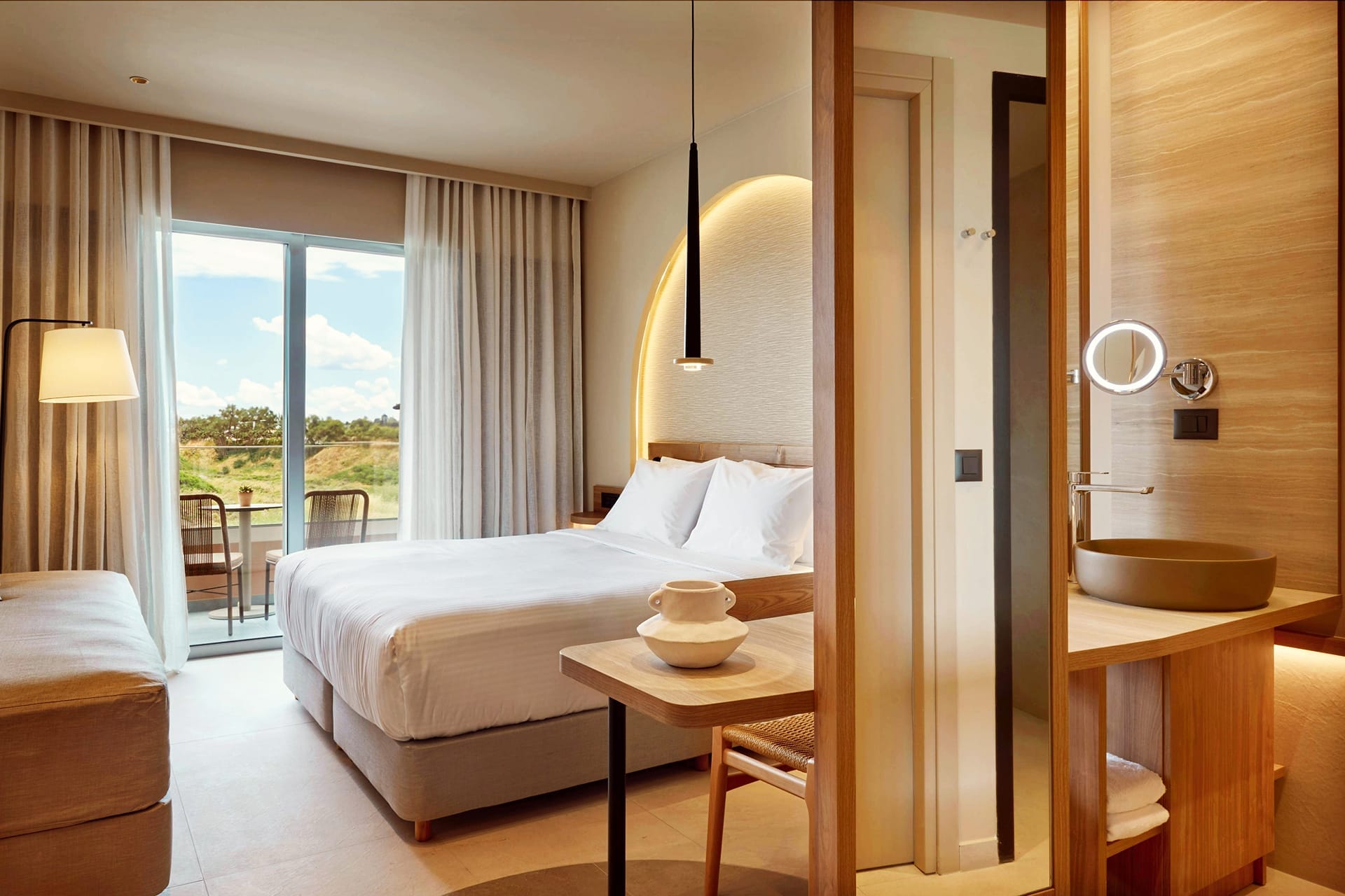 a bedroom with a large window