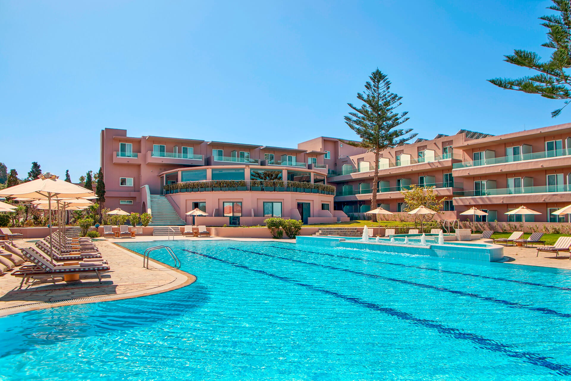 a swimming pool in front of a building