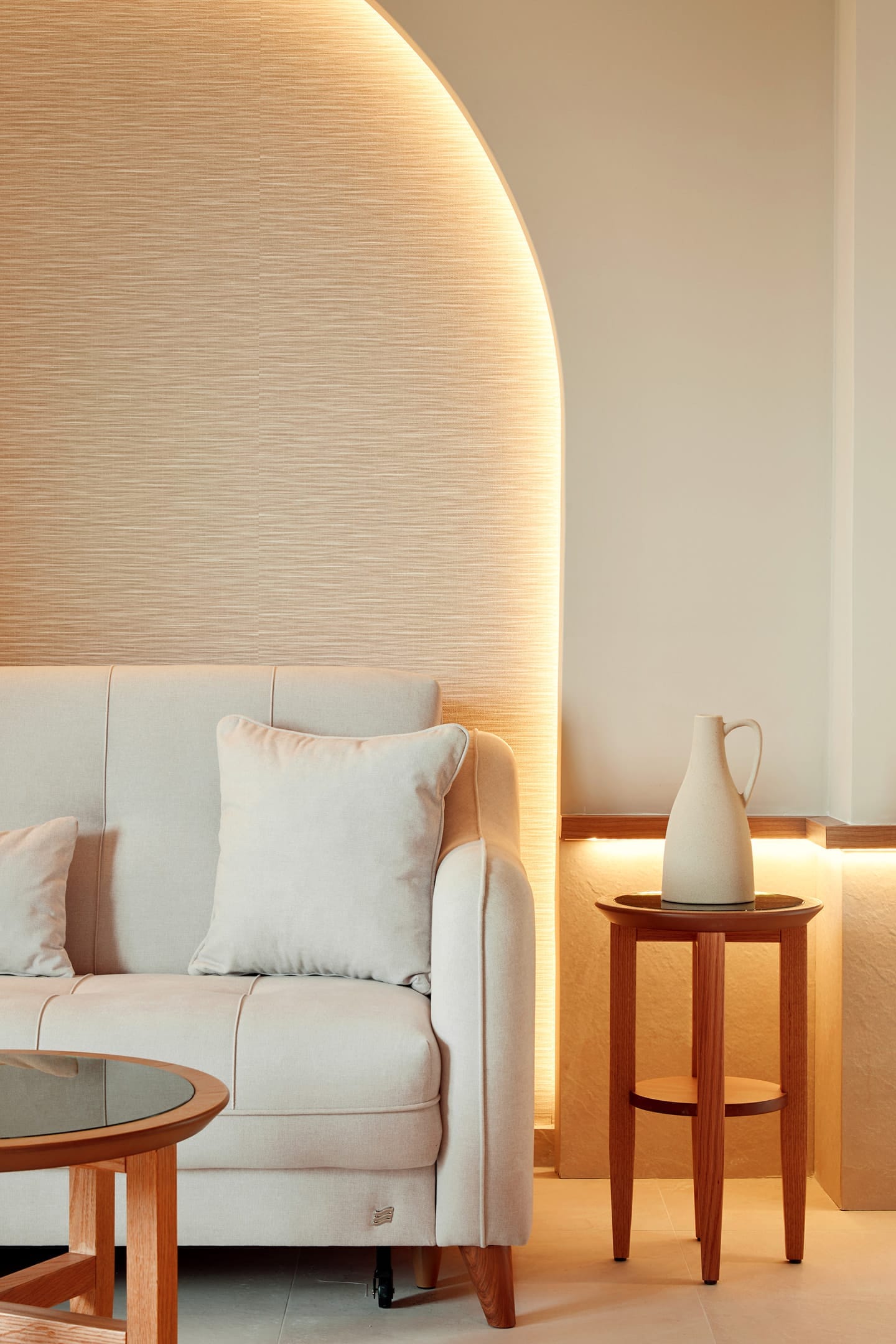 a white couch and a table