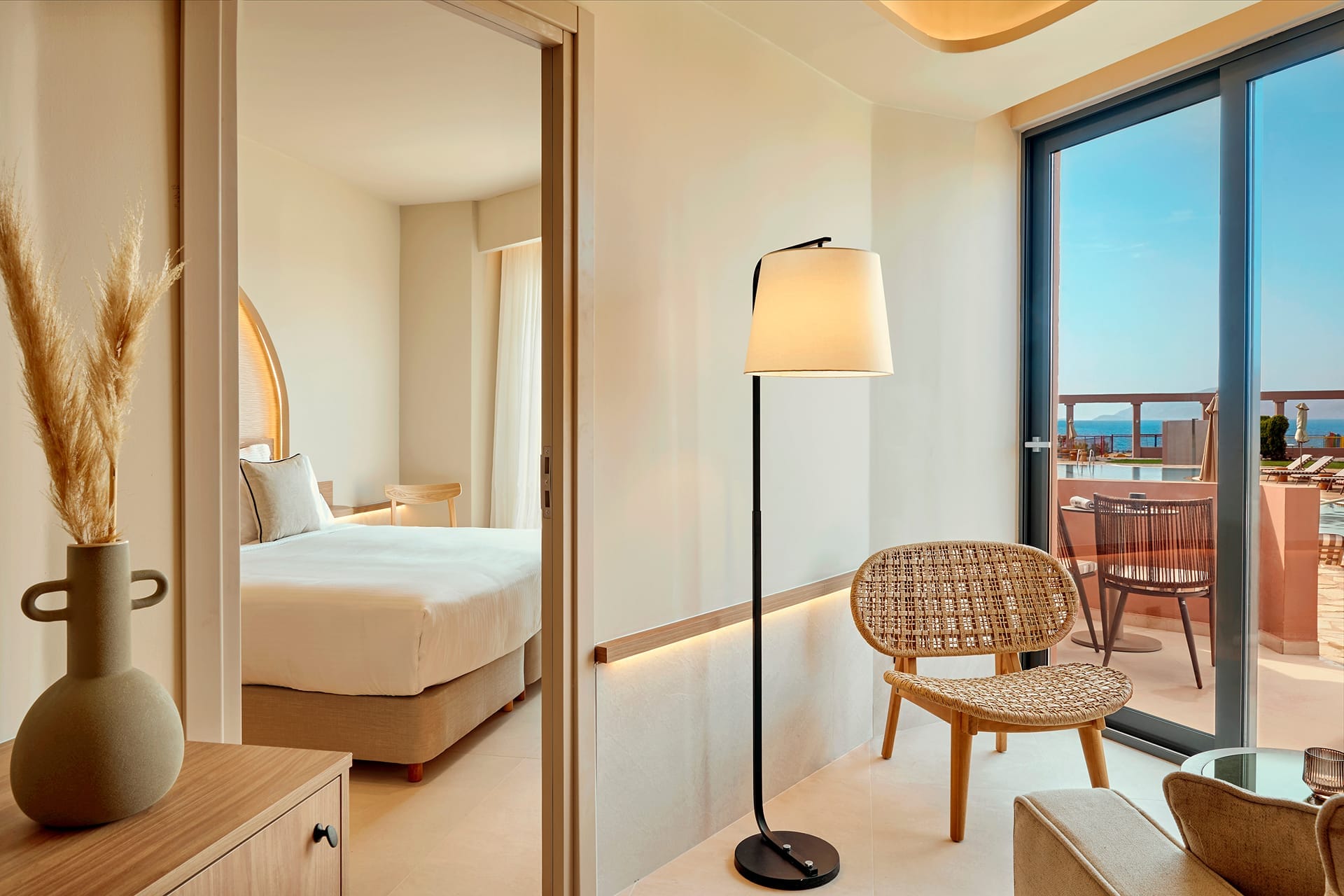 a bedroom with a bed and a lamp