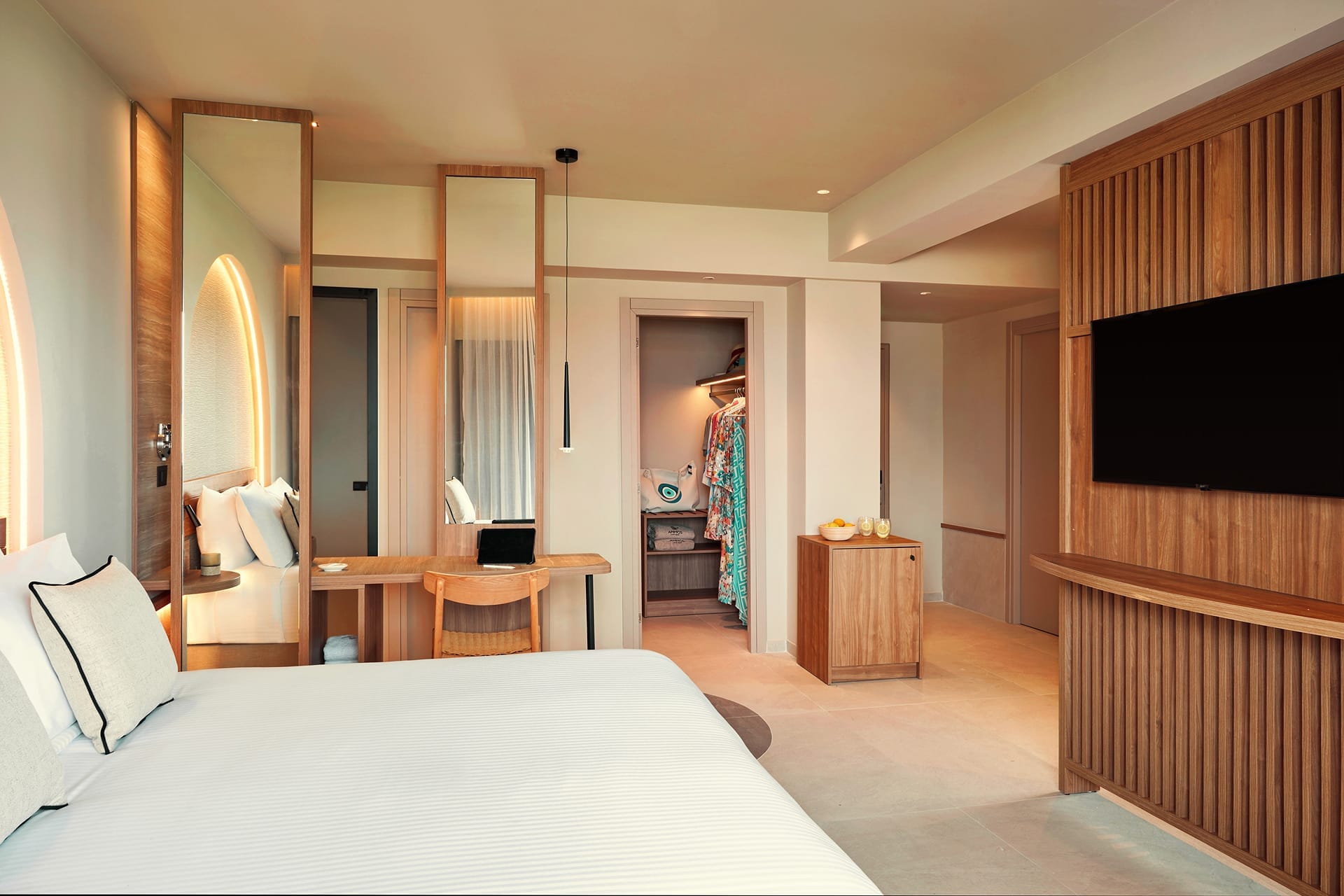 a bedroom with a large mirror