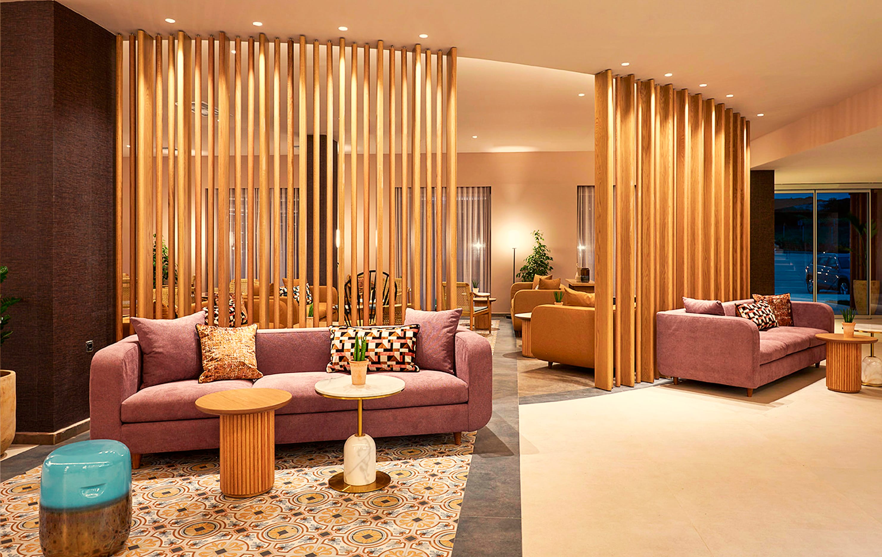 a living room with a pink couch