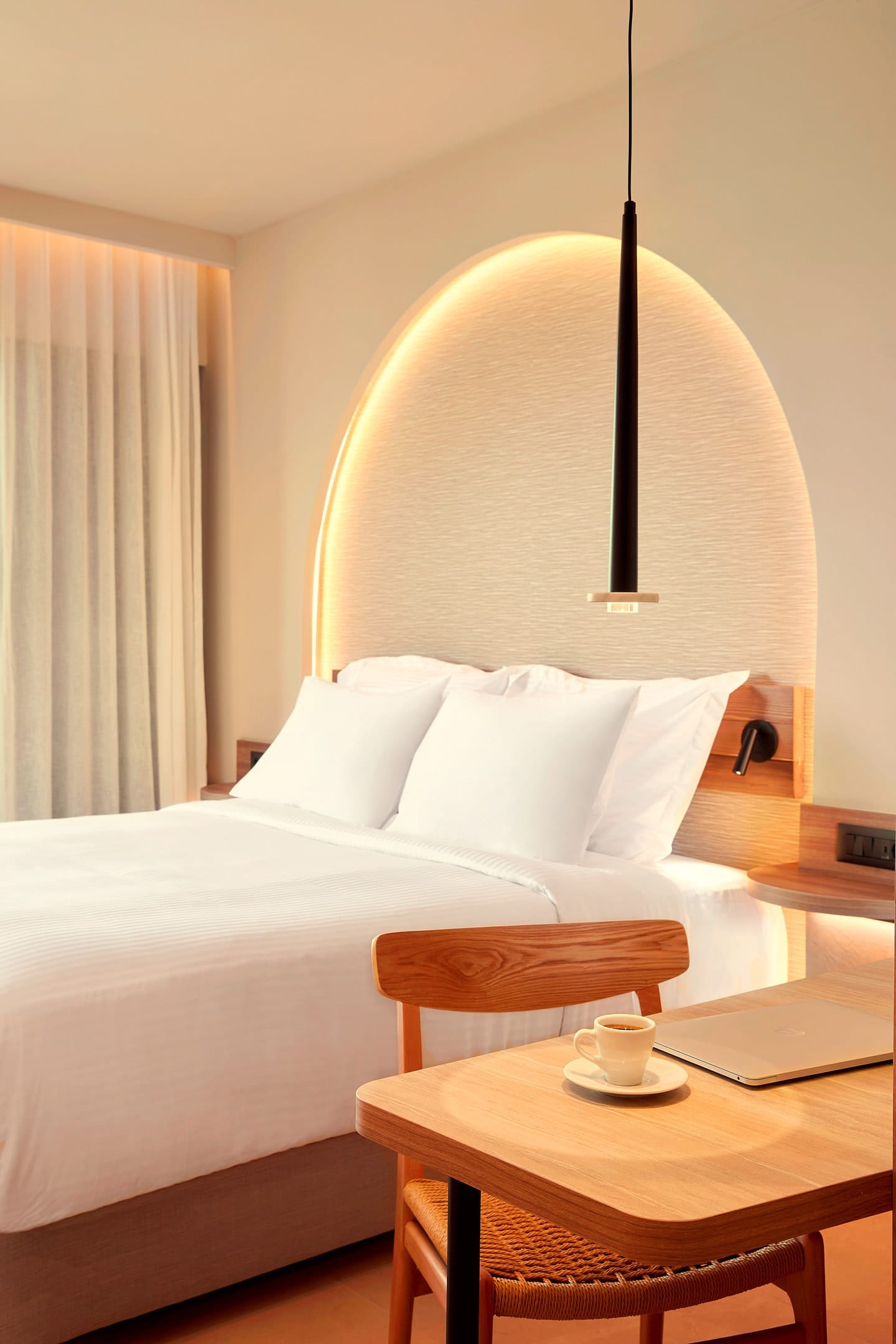 a bed with a lamp on it