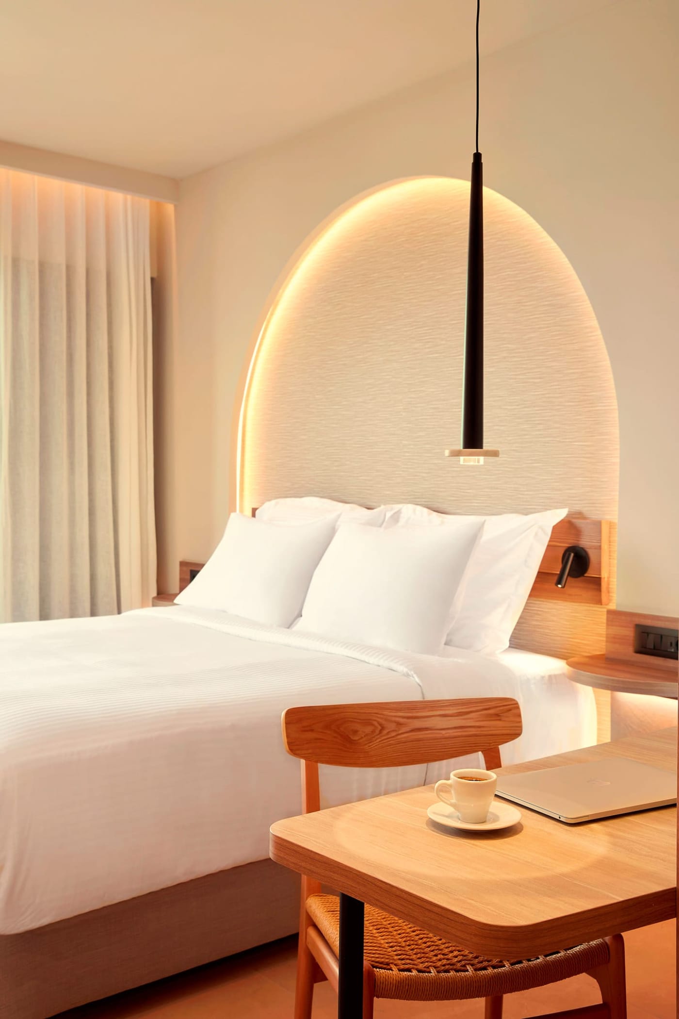 a bed with a lamp on it