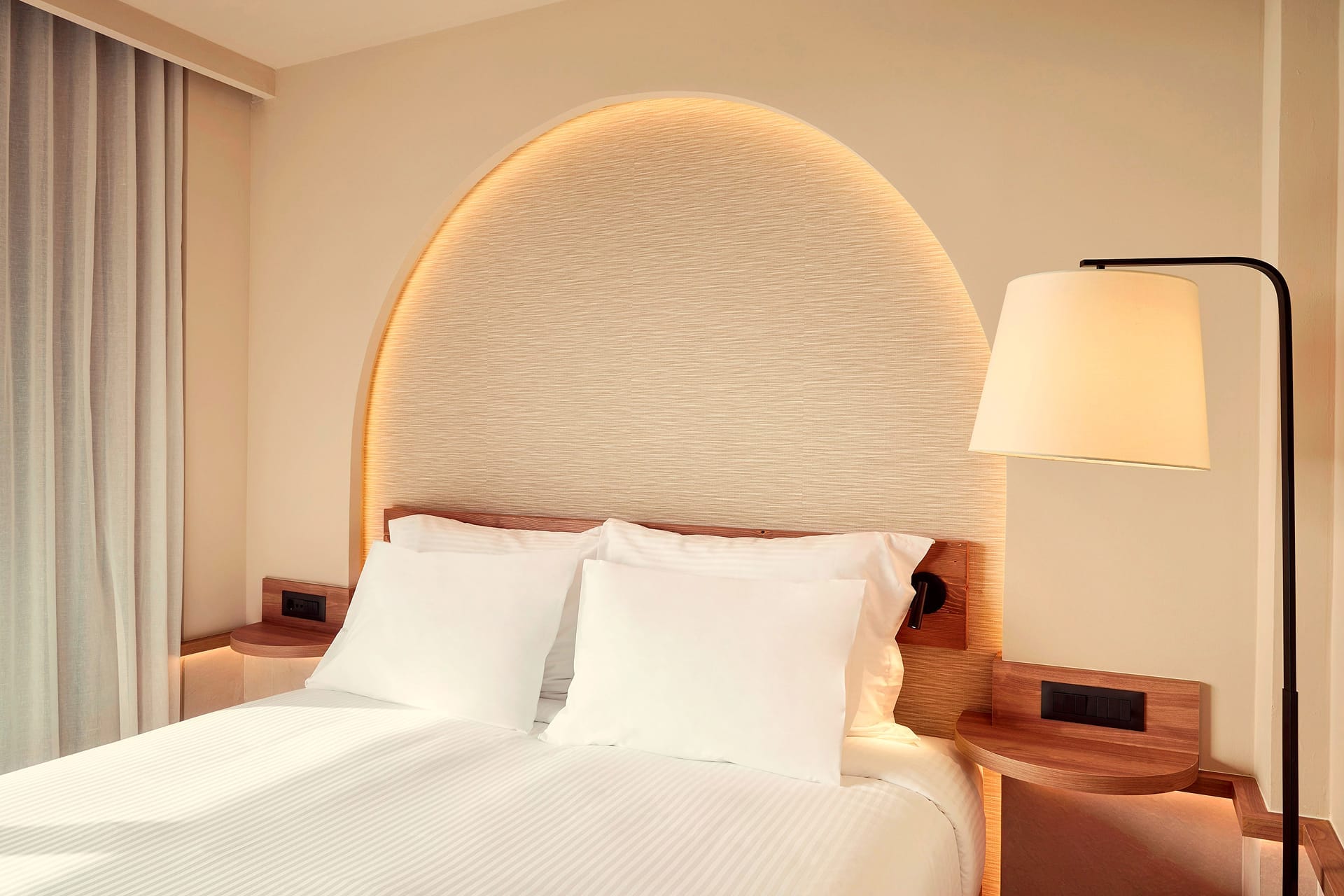 a bed with a lamp on it